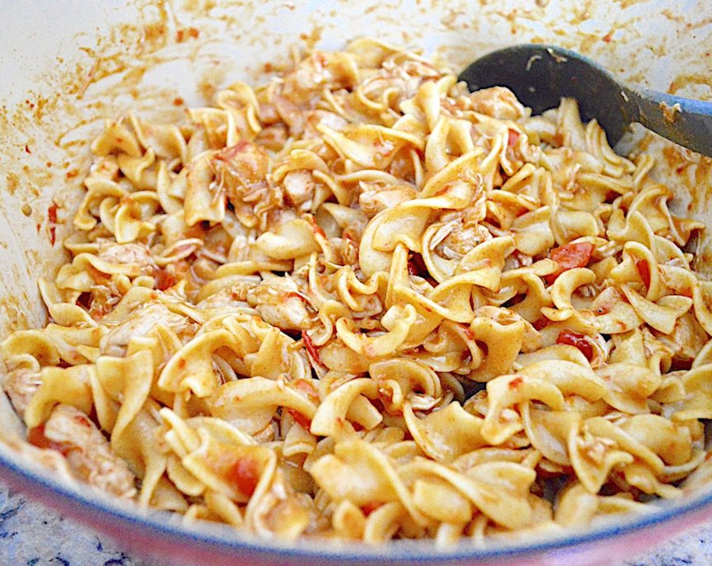 step 7 While that is happening, boil the noodles until tender according to the package directions. It should take about 8 minutes. Drain them and stir them into the pot with the rest of the dish.