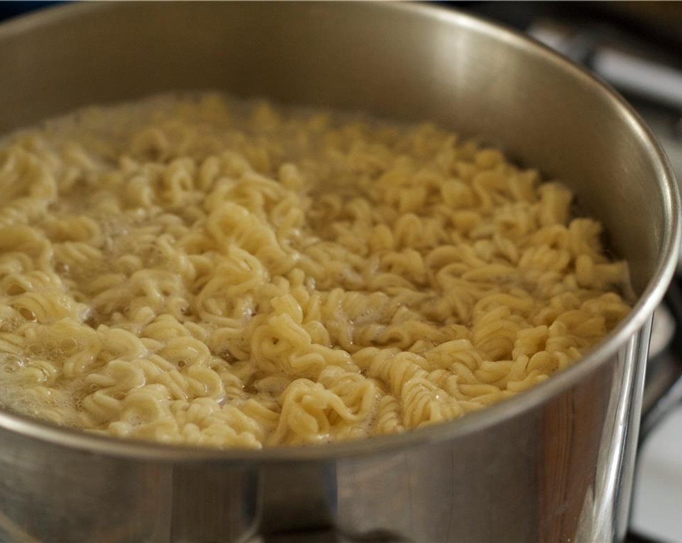 step 2 Cook Ramen Noodles (1 pckg) in pot of boiling water.