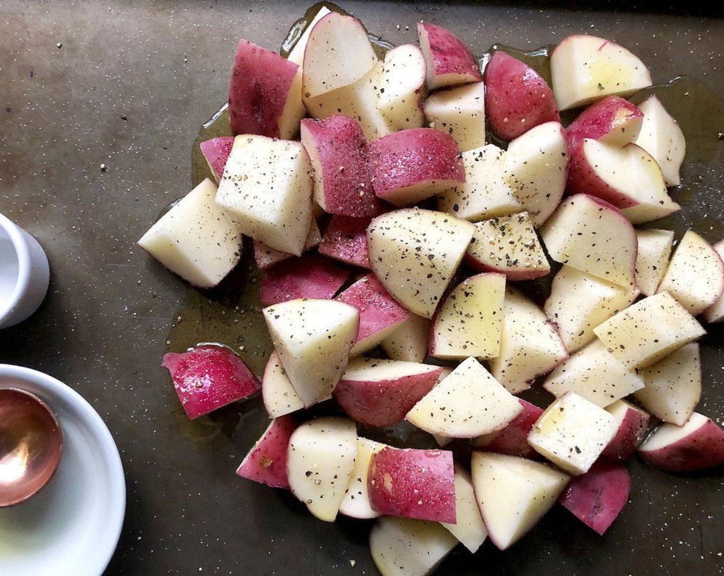 step 2 Toss the Red Potatoes (4 cups) with the Olive Oil (2 Tbsp), Salt (1/4 tsp), and Freshly Ground Black Pepper (1/4 tsp); arrange in single layer on rimmed baking sheet.  Bake 20 to 25 minutes or until golden brown and tender. Rearrange potatoes halfway through to promote even browning.
