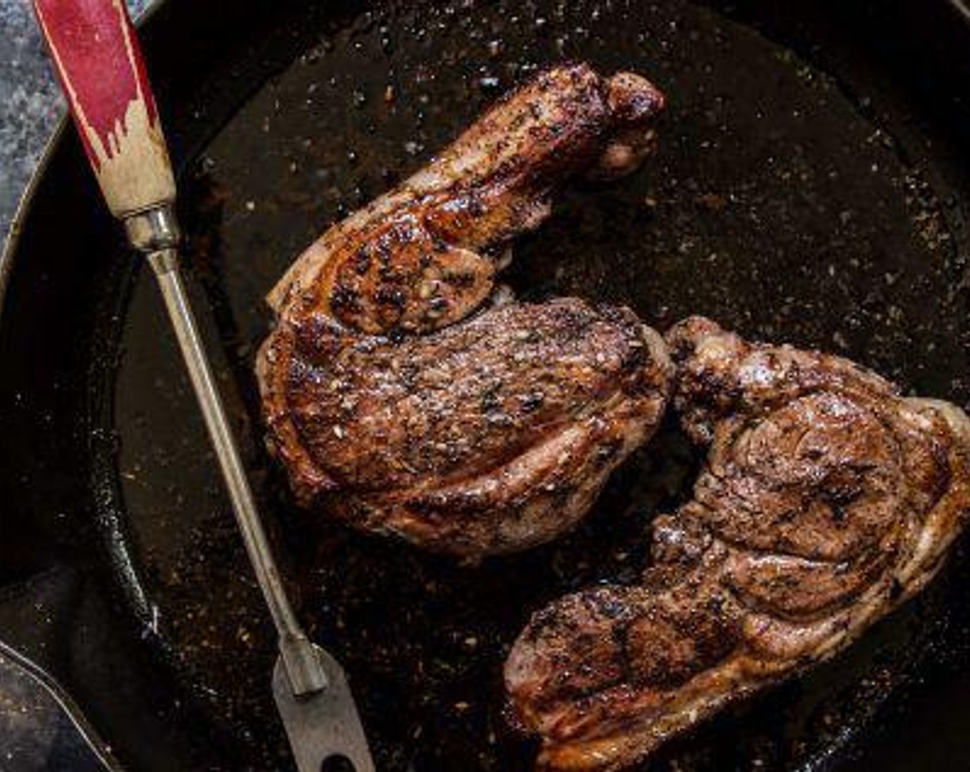 step 6 Sear the lamb steaks for about 2 to 3 minutes on each side or until a nice crust has appeared. Turn off the heat and place the skillet into the oven to continue to cook for about 7 minutes or until a thermometer reads 160 degrees F (70 degrees C) for medium.