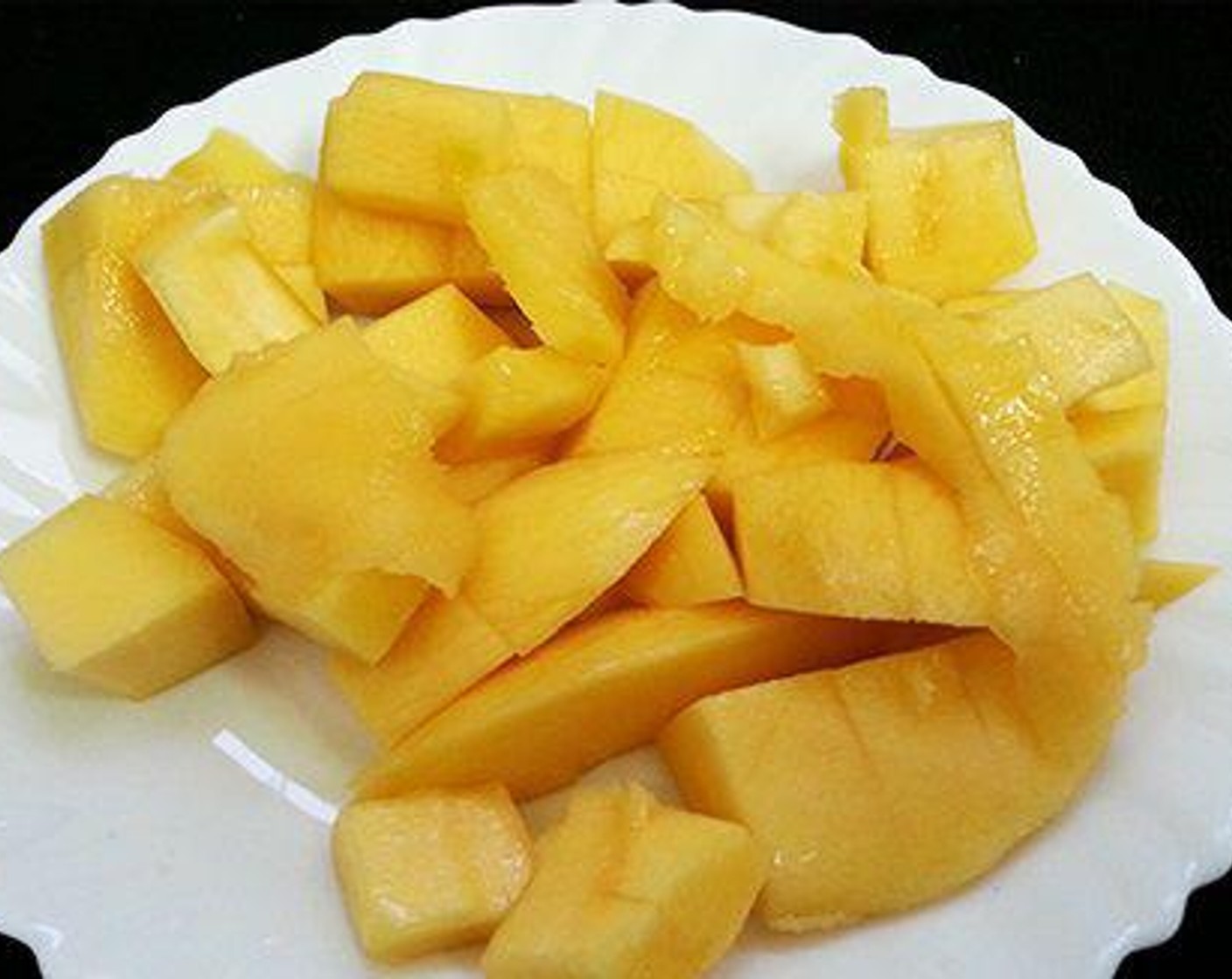 step 1 Peel the skin of the Mango (1) and chop it to small pieces.