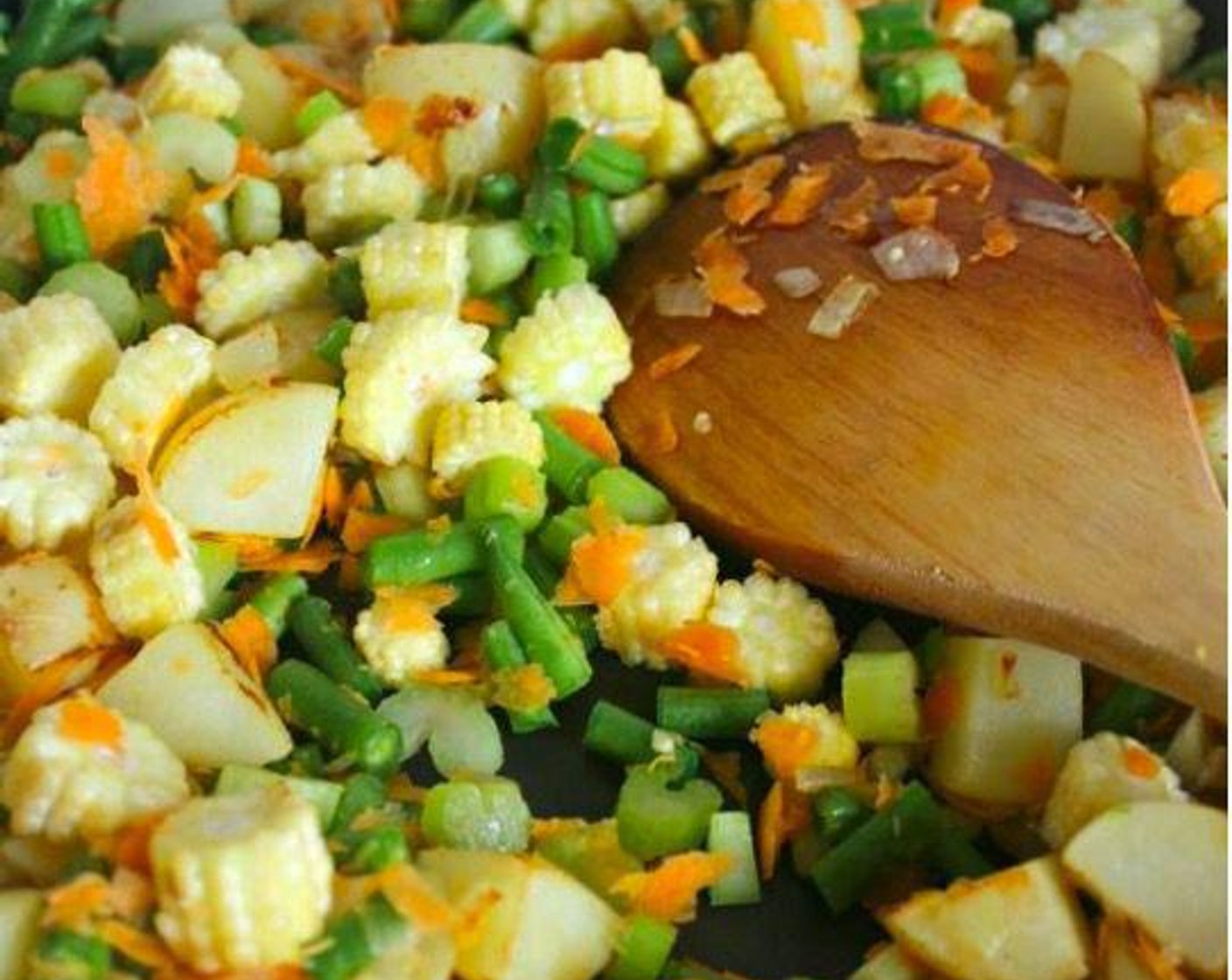 step 5 Place Green Beans (1 1/2 cups), Celery (4 stalks), Carrot (1), and Baby Corn (1 cup) in with the potatoes and stir fry for about 3 minutes. Remove from heat.