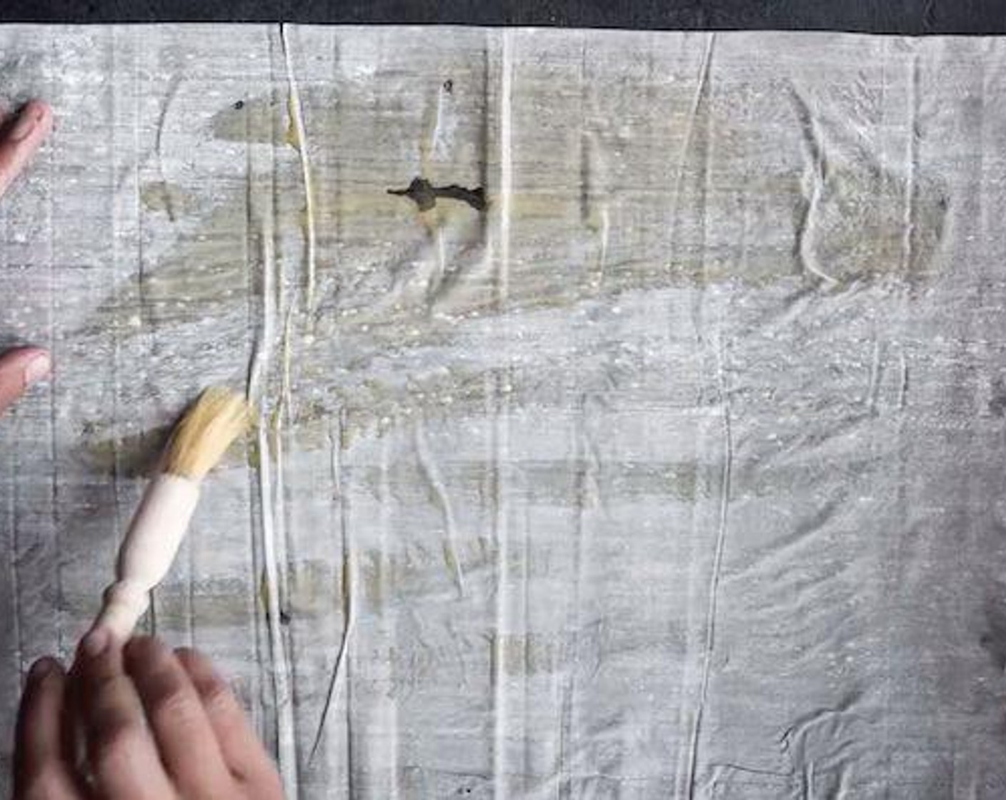 step 3 Place 1 sheet of Phyllo Dough (10 sheets) on a clean surface and brush it with Butter (3 Tbsp). Place another sheet of phyllo over the top of the first one and brush with butter.