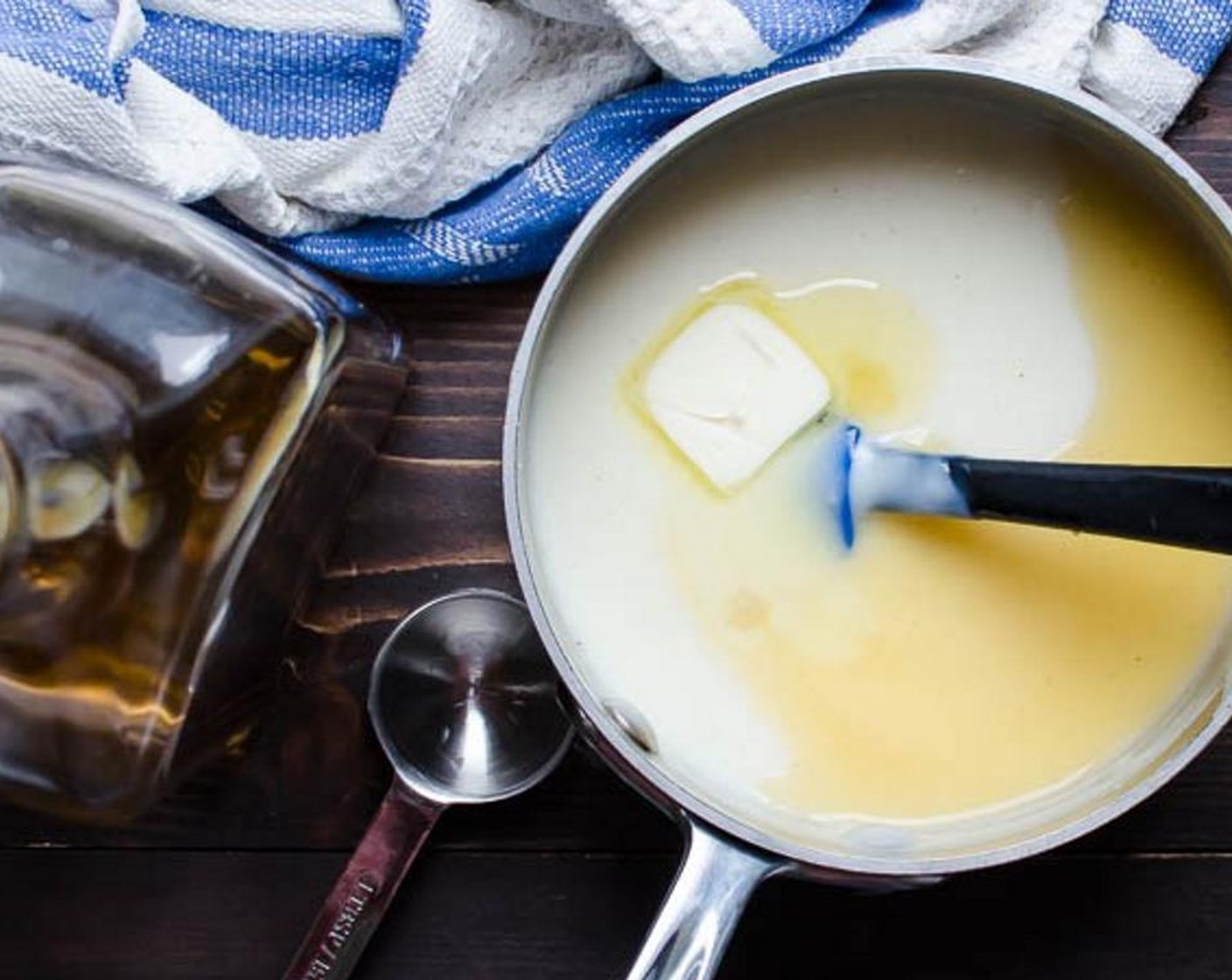 step 5 Whisk the cornstarch mixture into the hot milk mixture and stir constantly over medium heat until pudding begins to thicken. Remove from heat and stir in the Unsalted Butter (1 Tbsp) and Dark Rum (1 Tbsp) to combine.