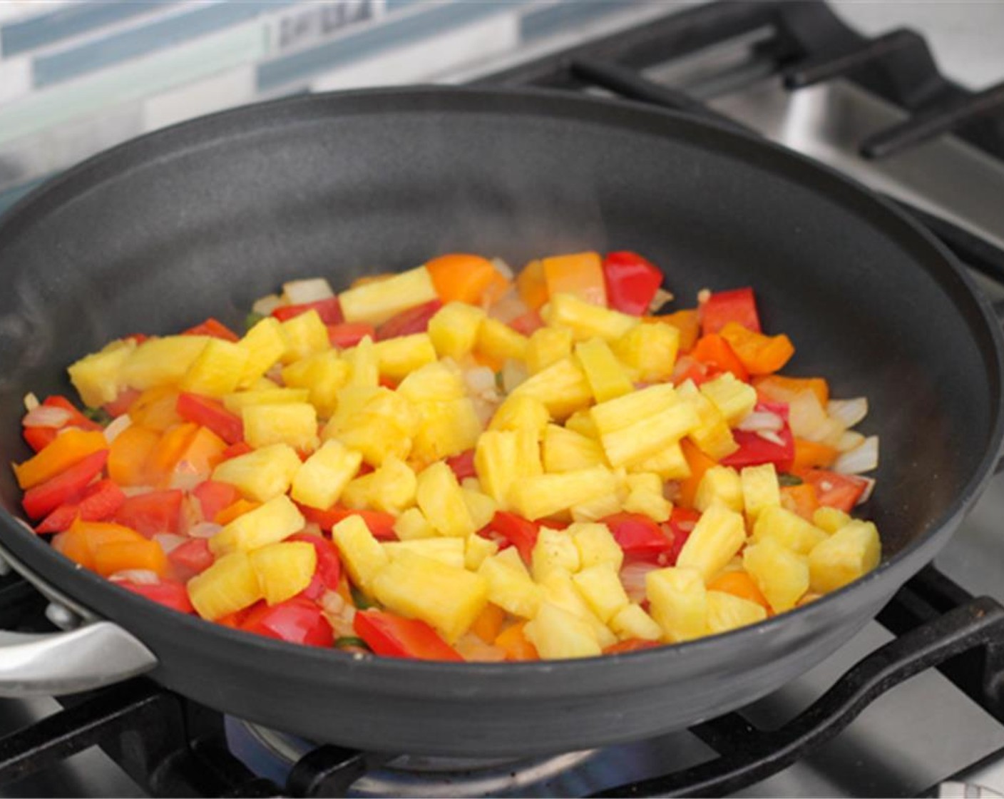 step 9 Add the chopped pineapple and cook for another 2-3 minutes.