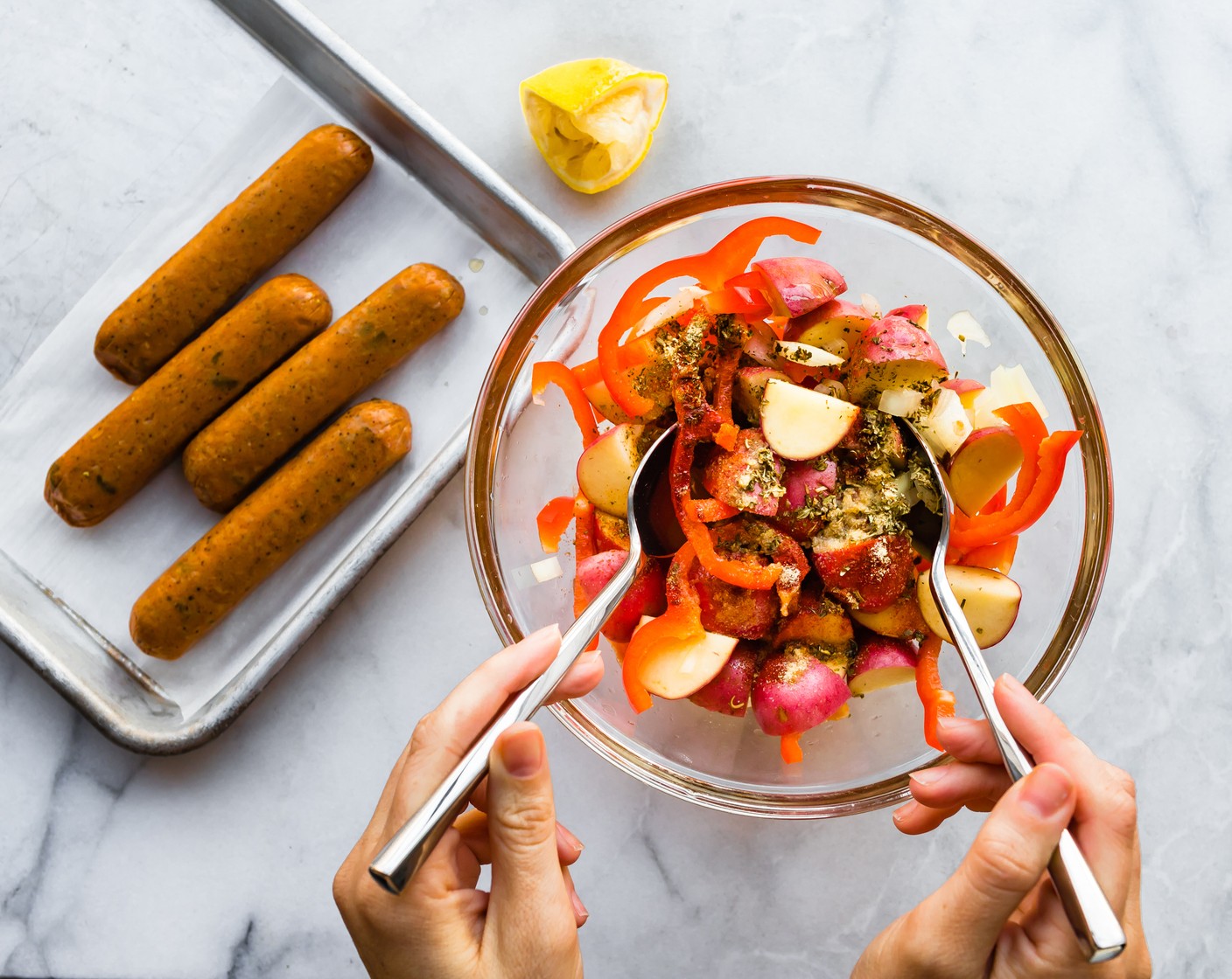 step 2 Place Red Potatoes (455 g), Bell Pepper (1), and Yellow Onion (1) in a large bowl or Ziploc bag. Add the Olive Oil (2 Tbsp), Smoked Paprika (1/2 tsp), Italian Seasoning (1 tsp), Garlic Powder (1 tsp), and juice from Lemon (1). Toss until veggies are thoroughly coated.