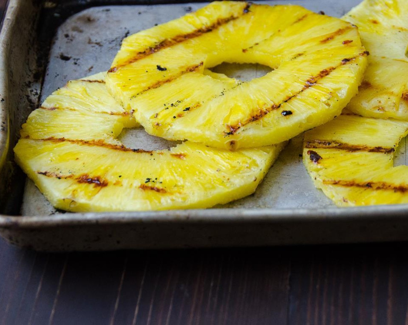 step 14 Meanwhile, grill the Pineapple (1) until you get some nice grill marks, flipping halfway through for about 5 to 8 minutes. Transfer to a platter.