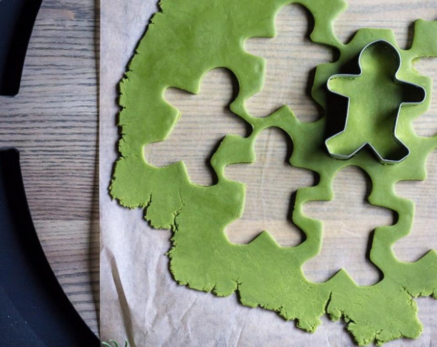 step 6 Cut out gingerbread men shapes (or any other shape) and place each cookie on a Silpat or parchment-lined baking sheet.