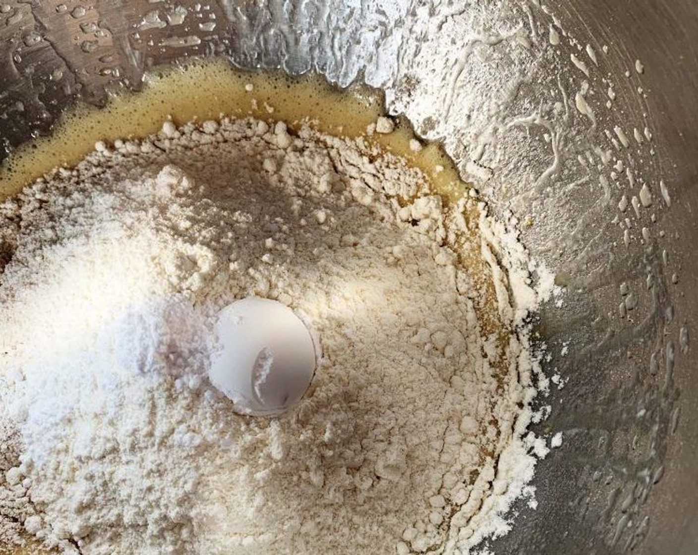 step 3 Add the Barley Flour (1 cup), Cake Flour (1 cup), Baking Powder (1 tsp), and Vanilla Extract (1/4 tsp), and mix everything together using the paddle attachment of a wooden spoon
