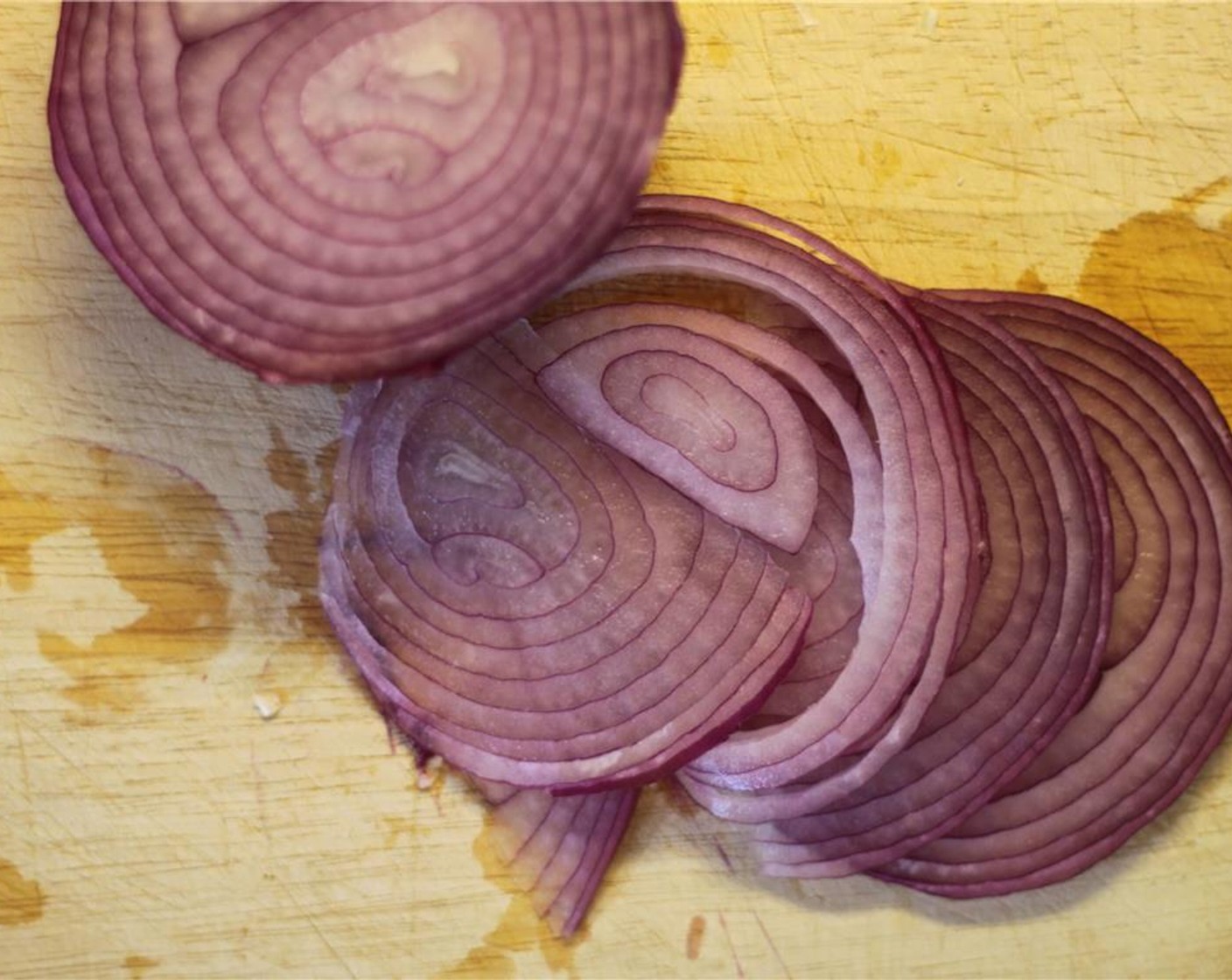 step 2 Thinly slice the Red Onion (1/2). Roughly chop the Garlic (6 cloves).