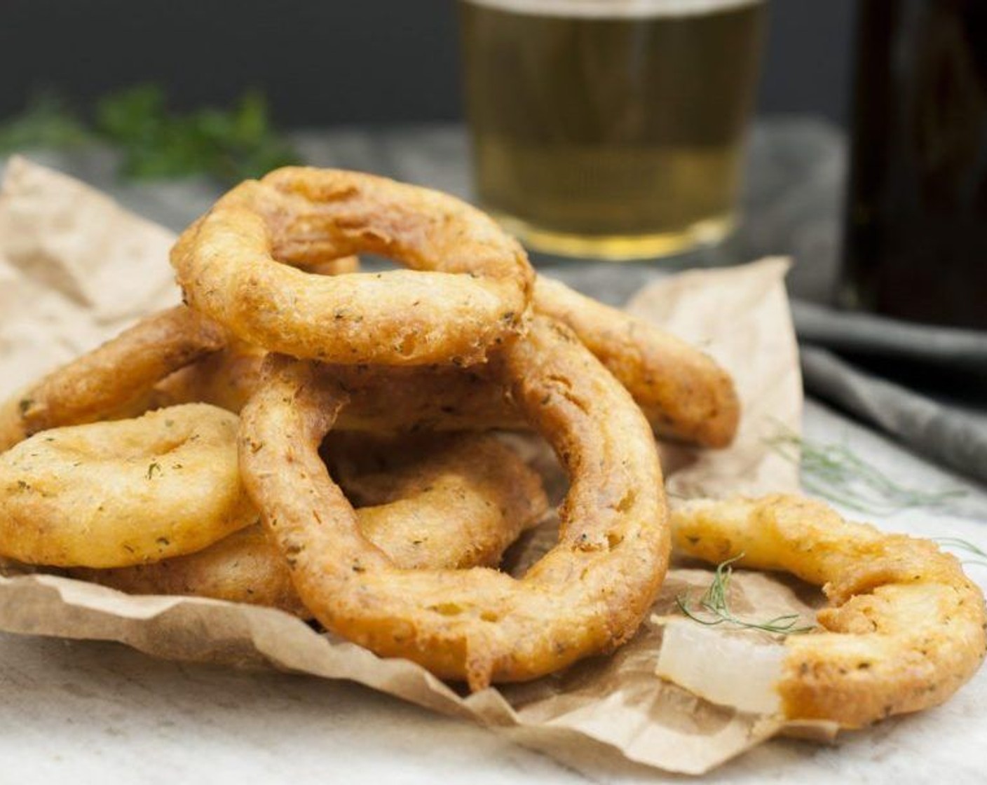 step 7 Remove with tongs or a slotted spatula to a paper towel-lined plate. Keep warm in a low oven while frying remaining onion rings. Serve warm.