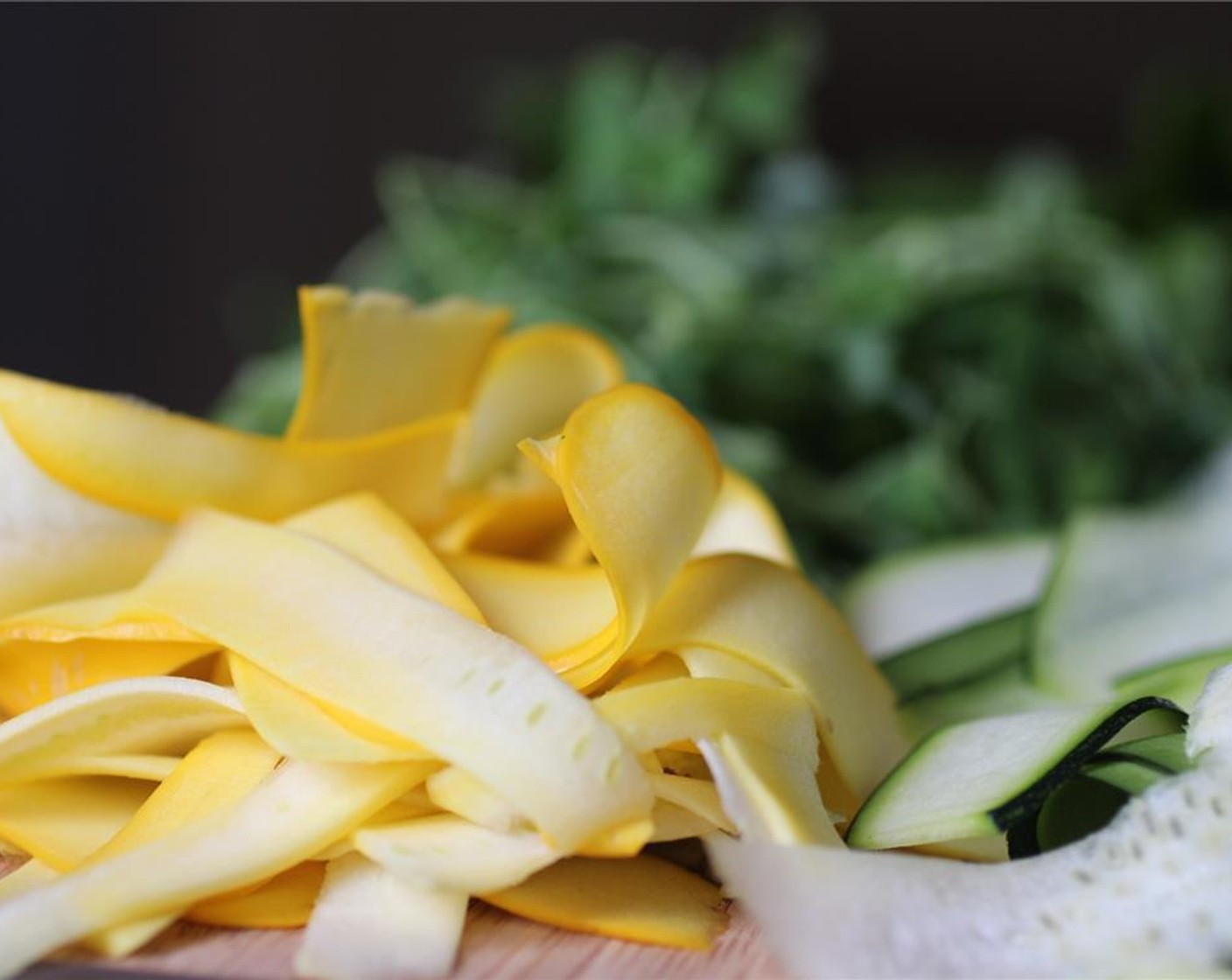 step 1 Thinly slice the Zucchini (1 cup) and Yellow Squash (1 cup) with a vegetable peeler. Mince the Onion (1/2 tsp).