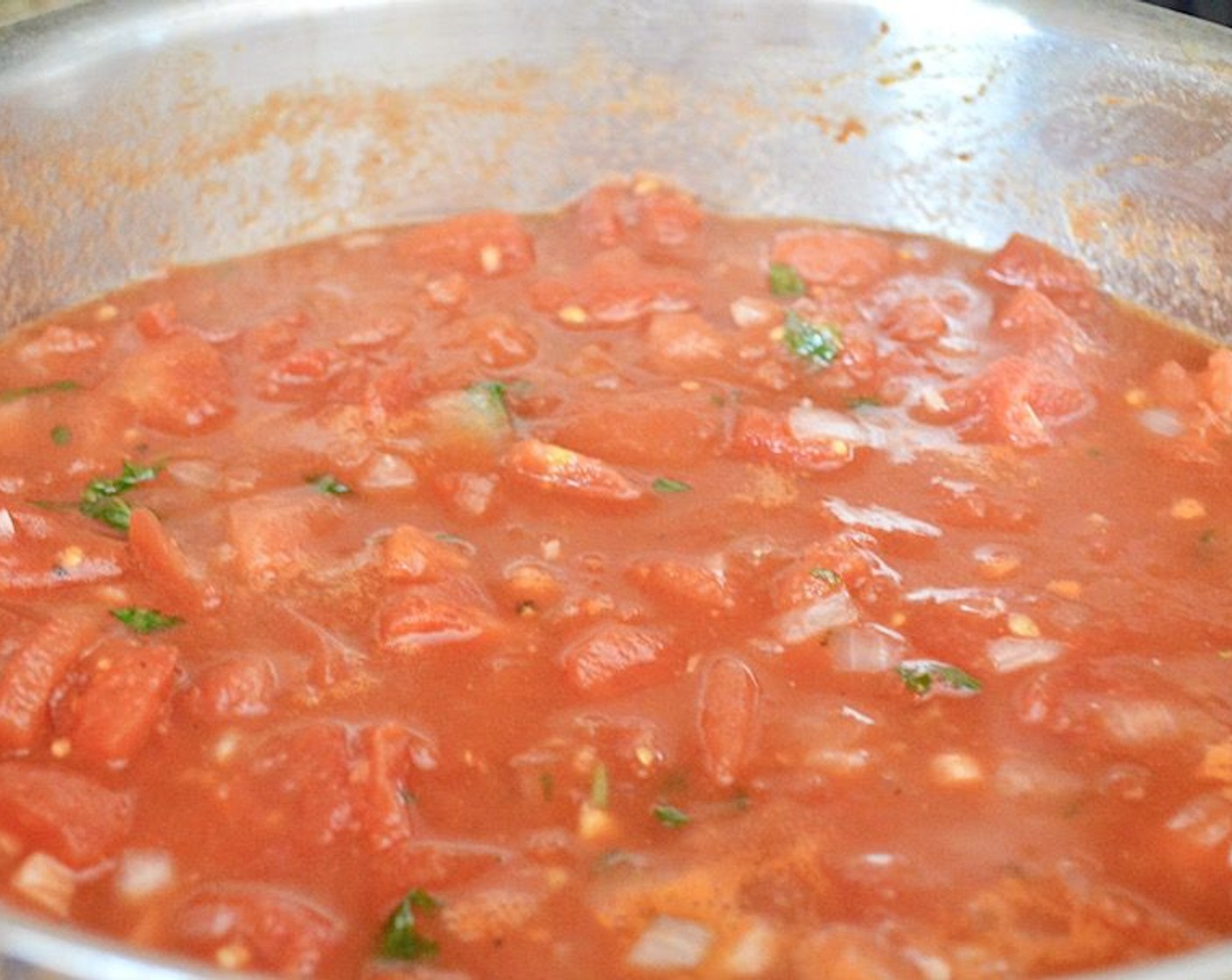 step 6 Add in the Canned Diced Tomatoes (3 1/2 cups), Salt (1 pinch), and Ground Black Pepper (1 pinch). Let it simmer and develop flavor.