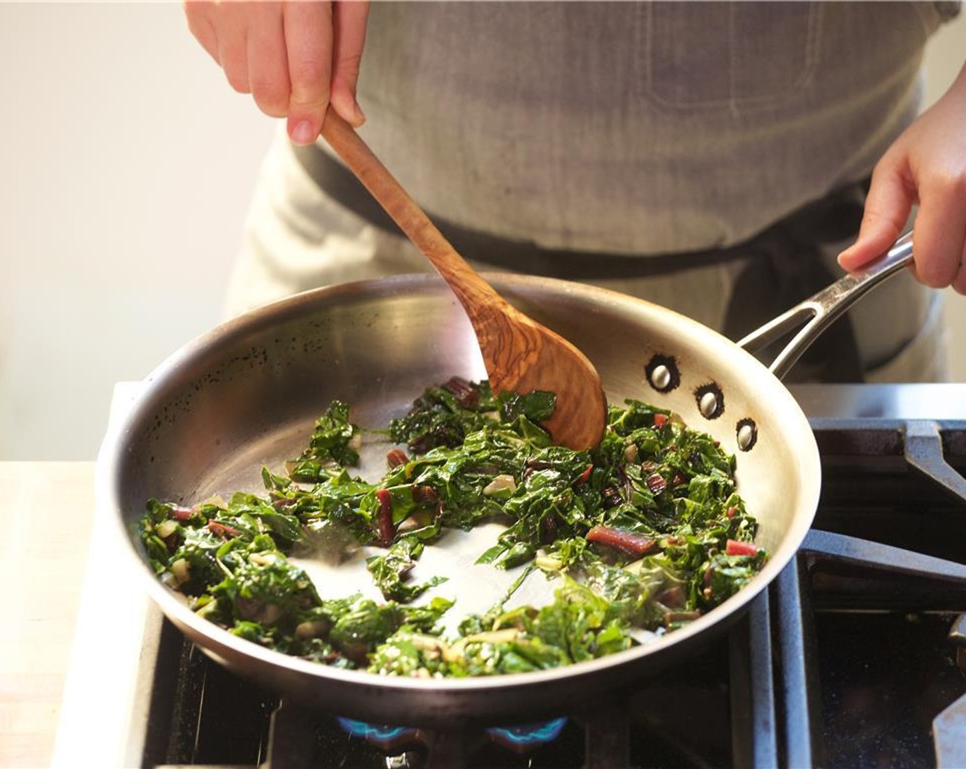 step 23 In a large saute pan over medium high heat, add olive Extra-Virgin Olive Oil (1 Tbsp).