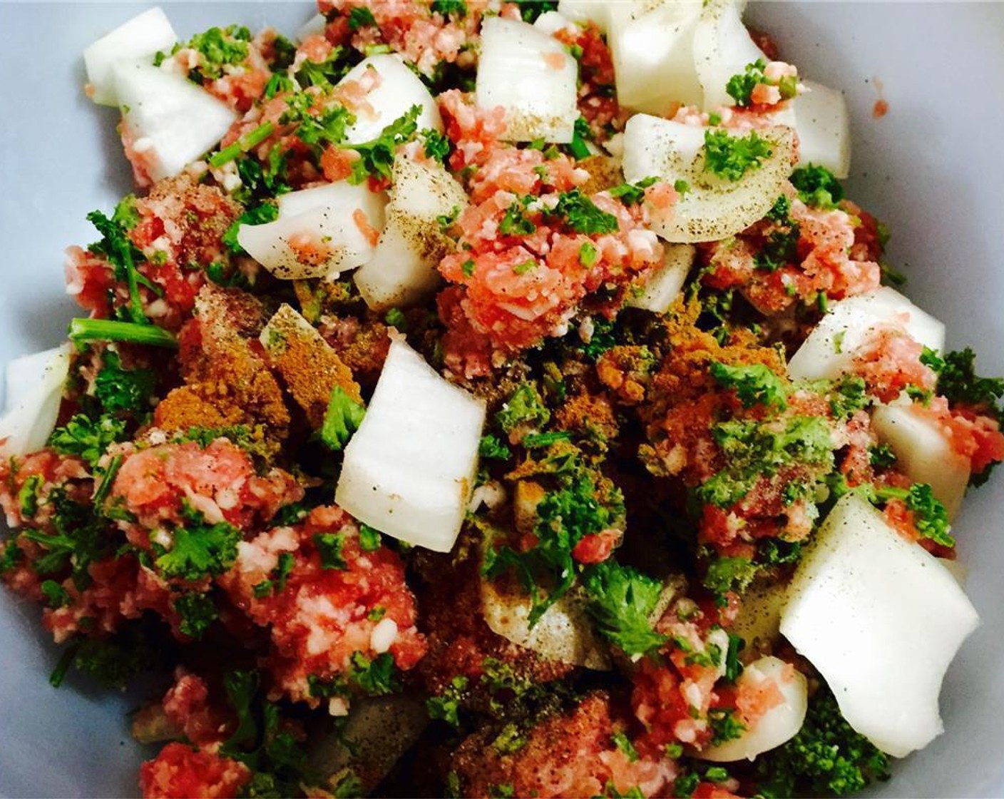 step 1 Mix the Ground Lamb (8 oz), Onion (1), Fresh Parsley (1 cup), Salt (1 tsp), Ground Black Pepper (1 dash), and Simply Organic Cinnamon, Ground (1 dash).
