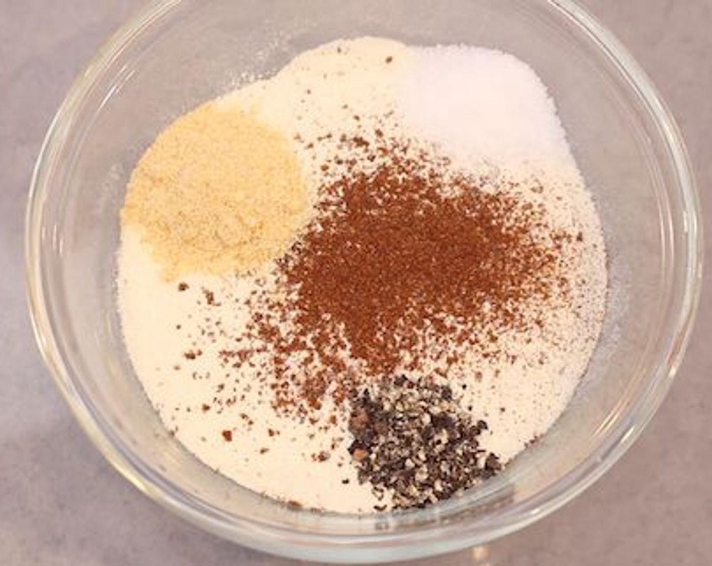step 1 Whisk your Eggs (2) and leave aside. To spice our Unflavored Protein Powder (1 1/2 cups), add in Paprika (1/2 tsp), McCormick® Garlic Powder (1/2 tsp), Ground Black Pepper (1/4 tsp) and Salt (1/2 tsp). Mix everything together until well combined.