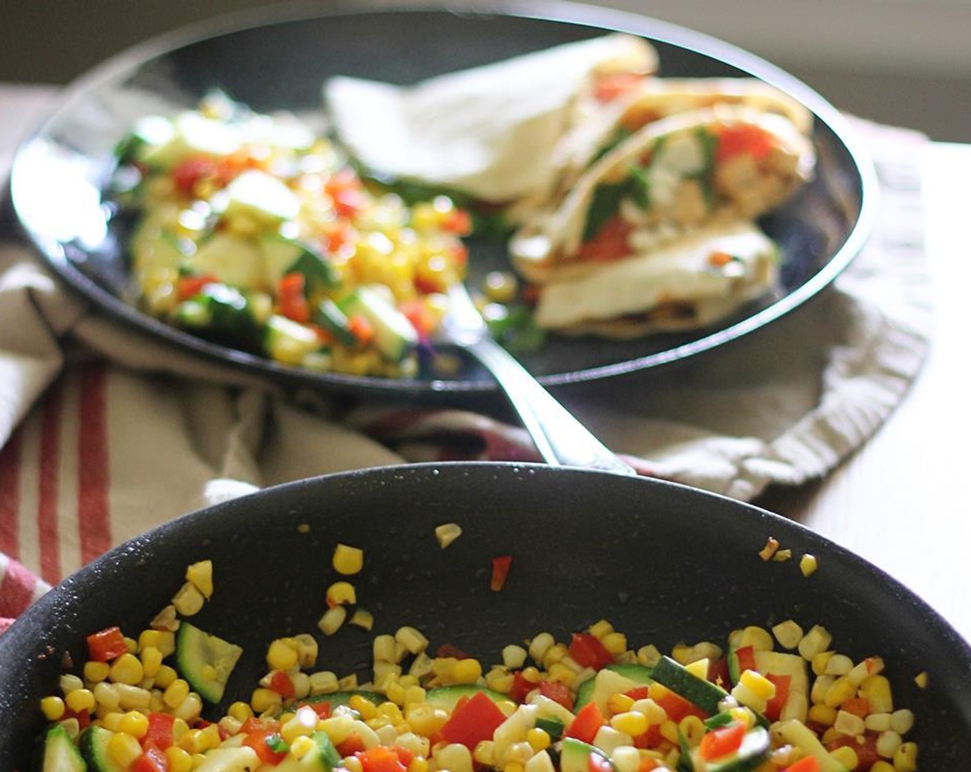 step 6 Next, add in Zucchini (1), Corn (2 ears), and Red Bell Pepper (1) and cook for about 5-6 minutes, stirring occasionally. Remove skillet from the heat, stir in Fresh Parsley (3 Tbsp) and season with Kosher Salt (to taste) and Ground Black Pepper (to taste).