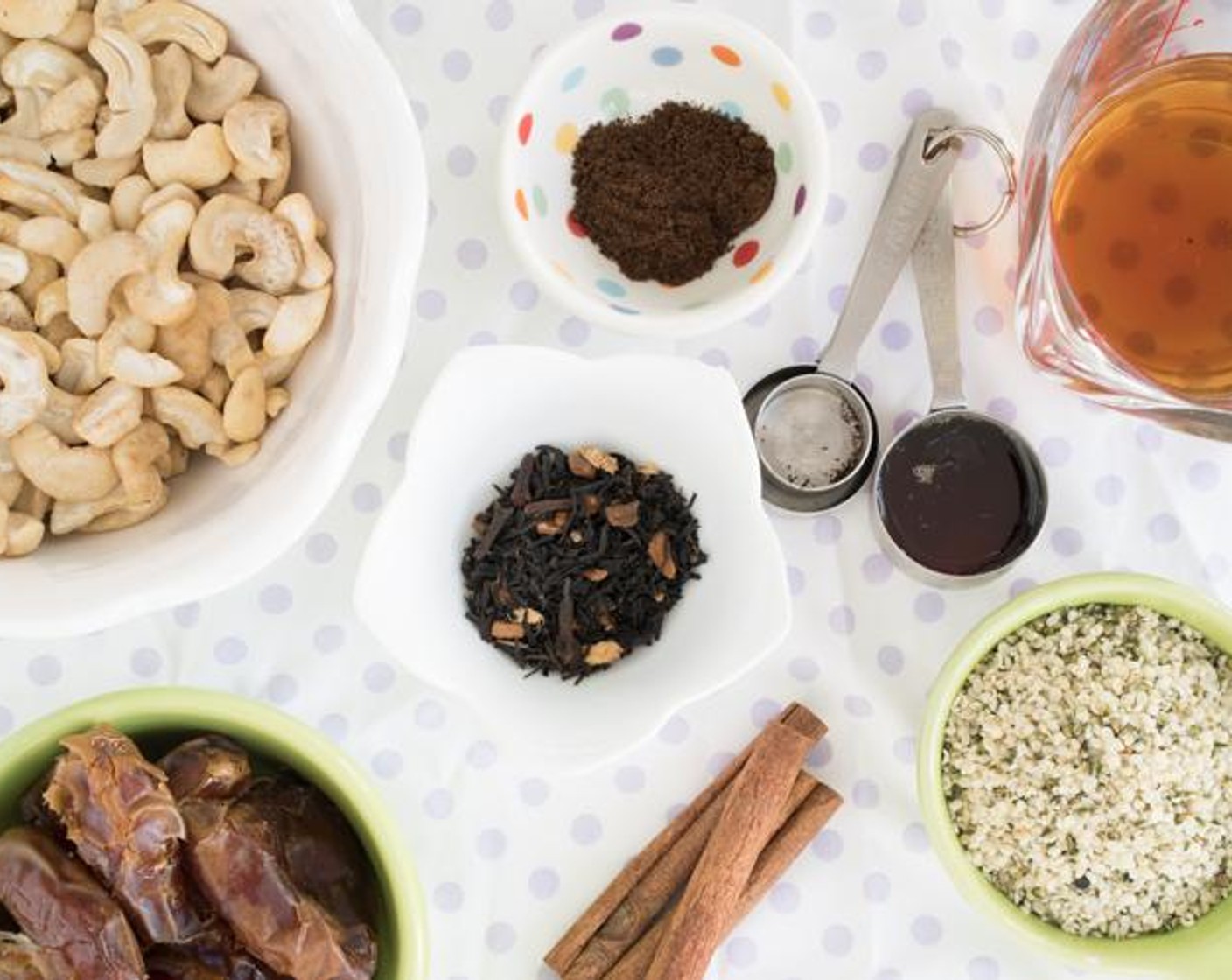 step 1 Place Loose Leaf Chai Tea (2 tsp), Maple Syrup (1 Tbsp), Cashew Nuts (1 1/4 cups), Medjool Dates (12), Vanilla Powder (1 tsp), and Simply Organic Cinnamon, Ground (1 tsp) into a blender or food processor and blend until crumbly, not smooth.