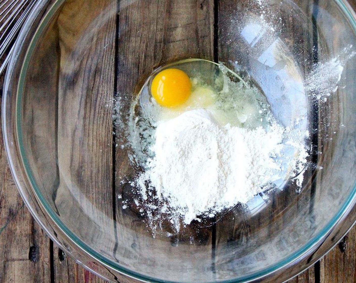 step 6 Meanwhile, place Farmhouse Eggs® Large Brown Egg (1) and the All-Purpose Flour (3 Tbsp) in a large bowl and whisk until smooth.