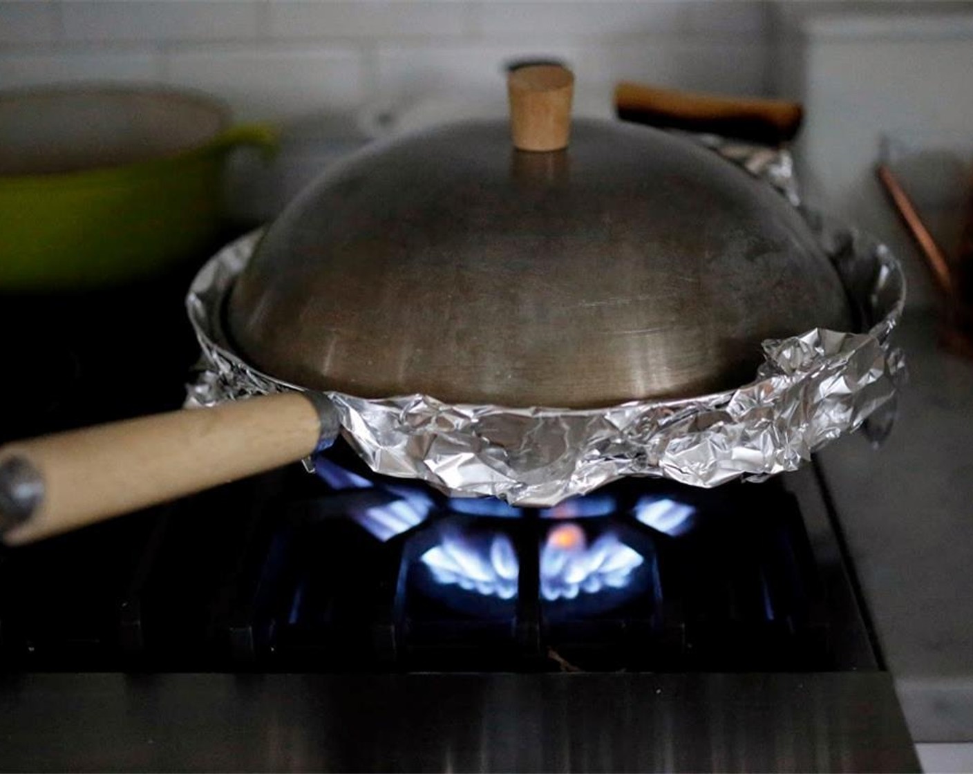 step 13 Cover the wok with foil, then the lid. Place wok on high heat for 2 to 3 minutes until you begin to see little puffs of smoke.