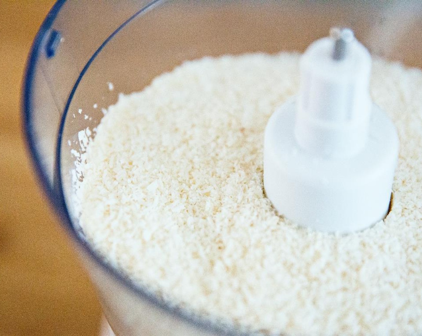 step 1 Place the Unsweetened Shredded Coconut (3 cups) in a food processor.