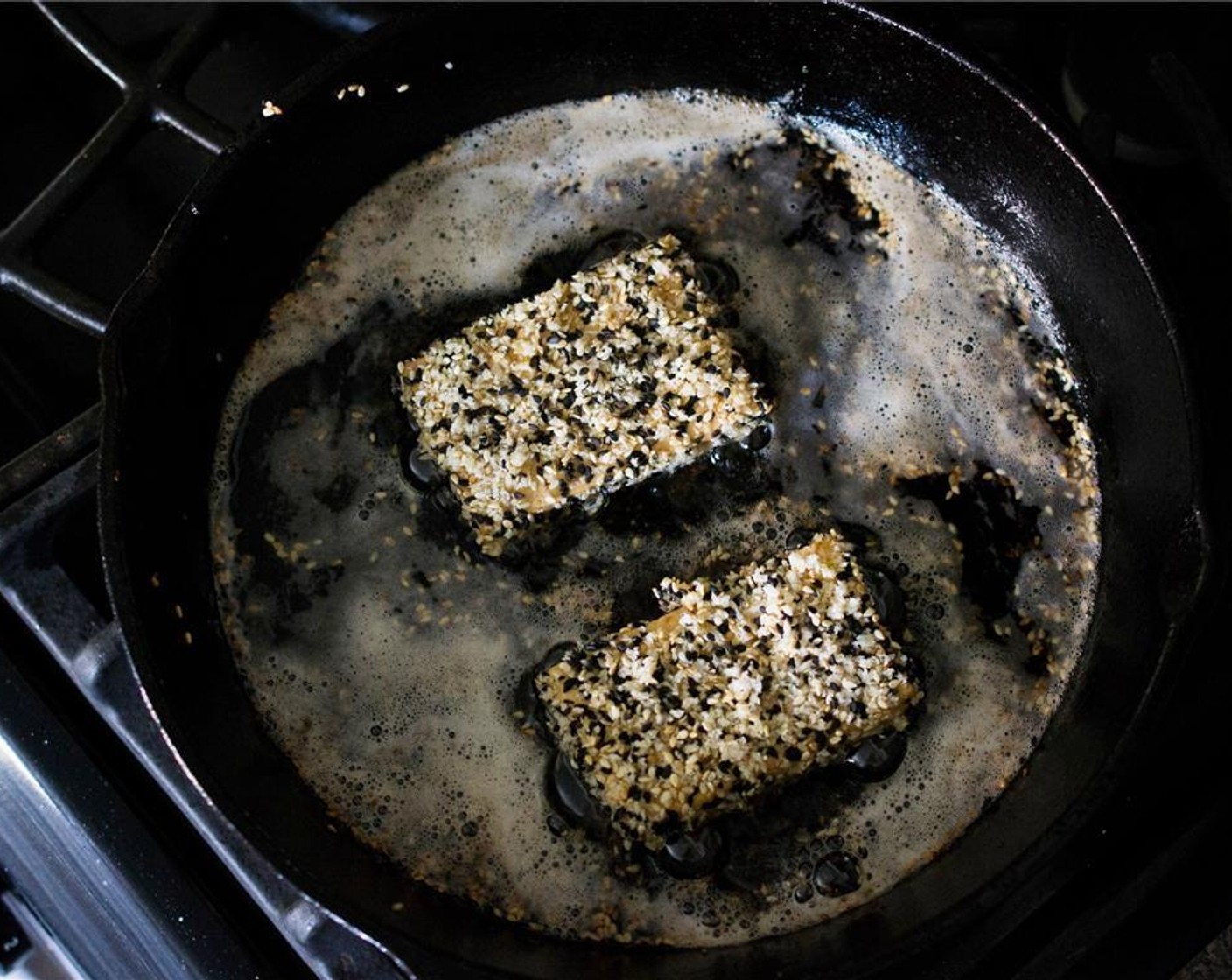 step 9 Over medium-high heat, add enough Vegetable Oil (as needed) to cover the bottom of a heavy-bottomed skillet. Once hot, add the tofu slices in batches. Cook 2-3 minutes (or until golden-brown) on the first side.