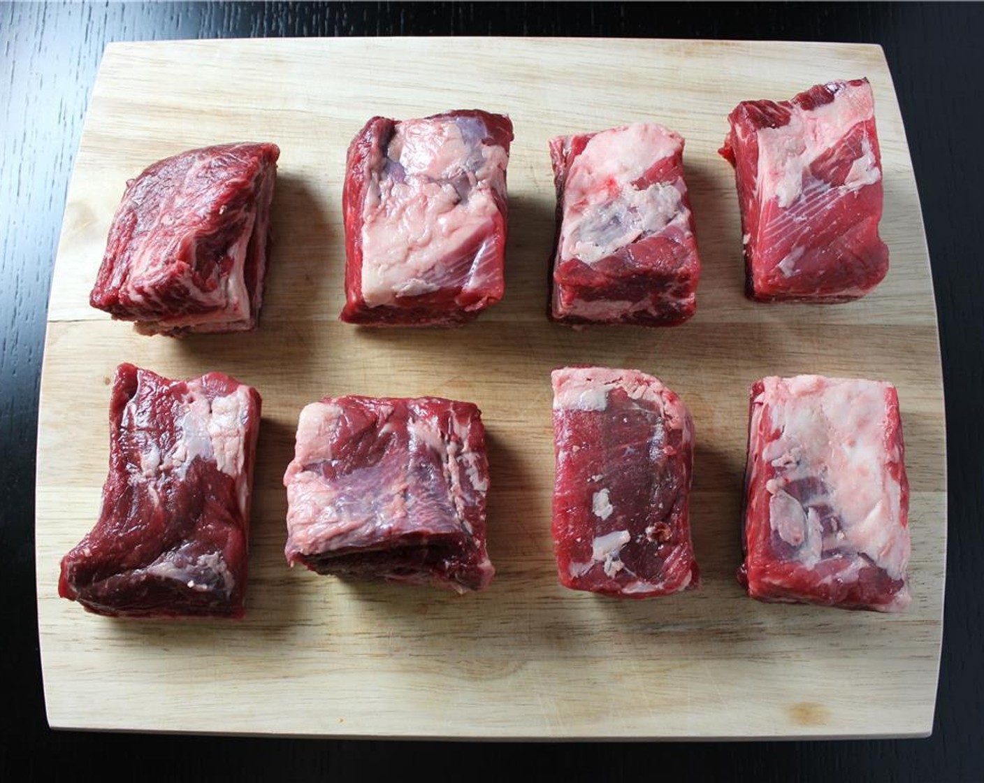 step 2 Heat a large sauté pan or cast iron pan to high heat with some Olive Oil (as needed) to coat. Season all sides of the Beef Short Ribs (8) with Salt (to taste) and Ground Black Pepper (to taste).