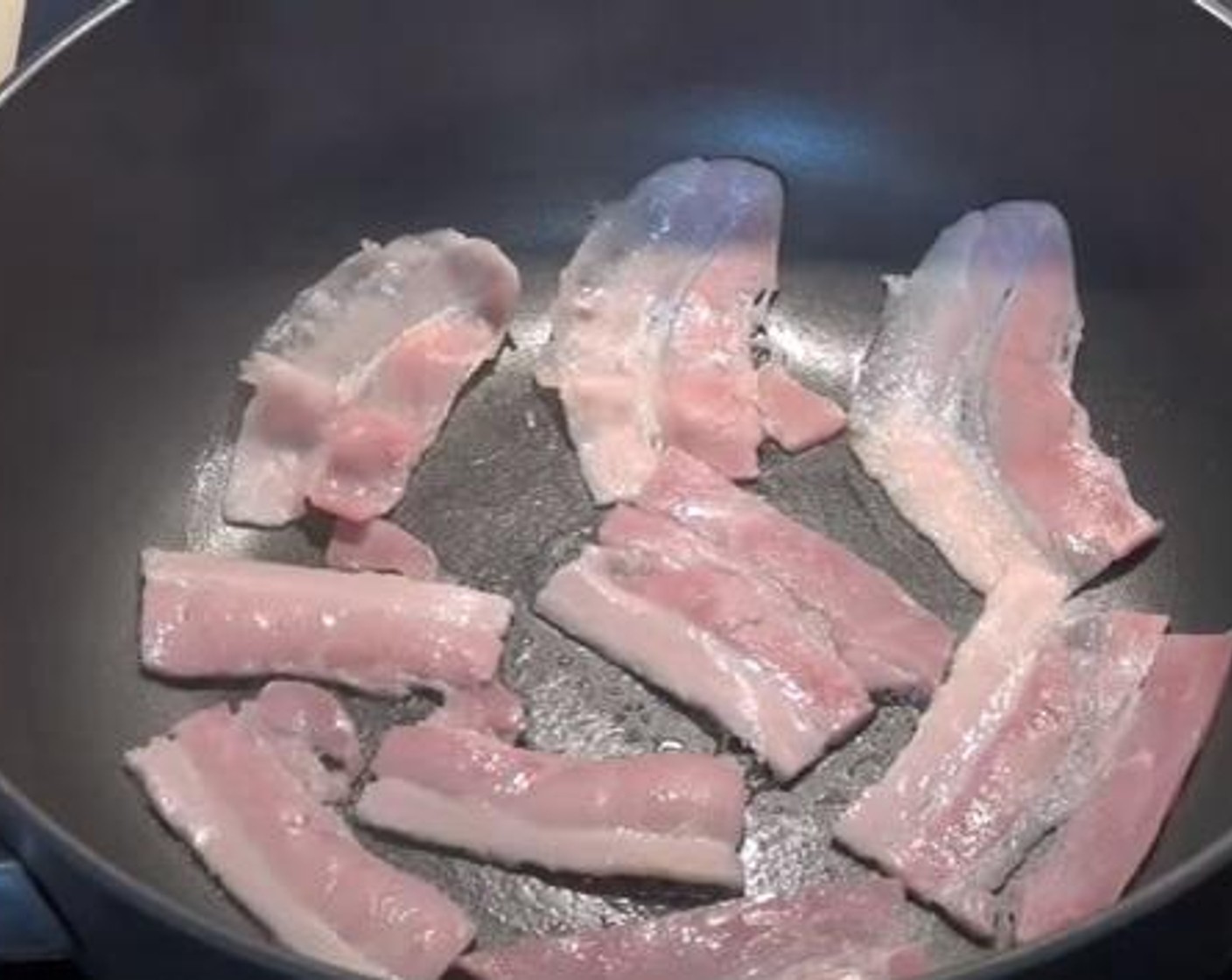 step 1 On a fried pan over medium heat, add a little bit of oil and cook your Bacon (3 slices) for about 3 minutes.