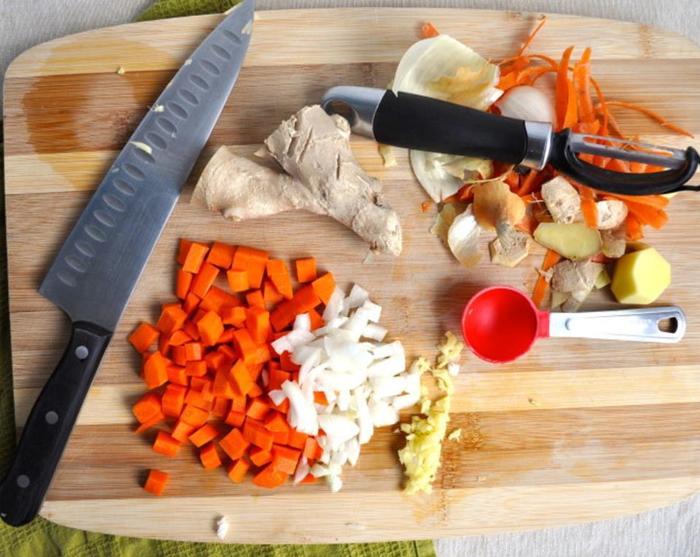 step 1 Dice the Carrot (1) and Onion (1). Mince the Fresh Ginger (2 Tbsp). Slice the Scallion (1 bunch). Roughly chop the Beet Greens (2 cups).