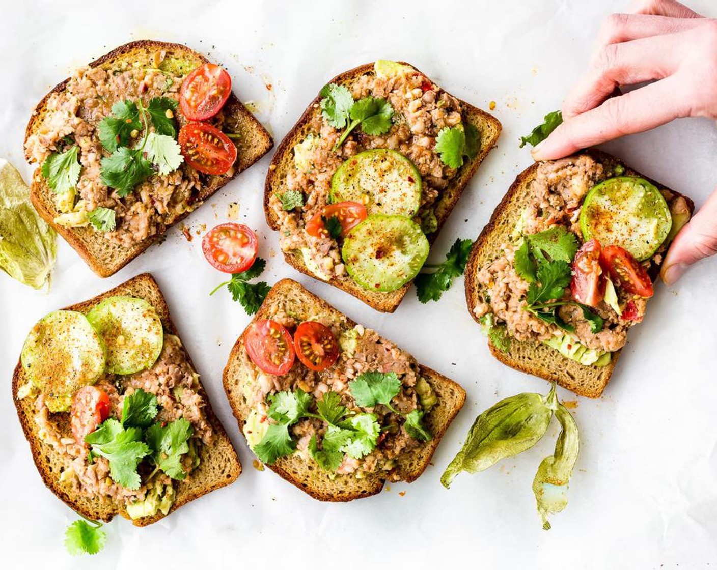 step 6 Garnish with Fresh Cilantro (to taste) and add any additional seasonings of choice like Chili Powder (to taste), Crushed Red Pepper Flakes (to taste), Onion Powder (to taste), or Mexican Seasoning (to taste). Drizzle Olive Oil (to taste) on top of each avocado toast.