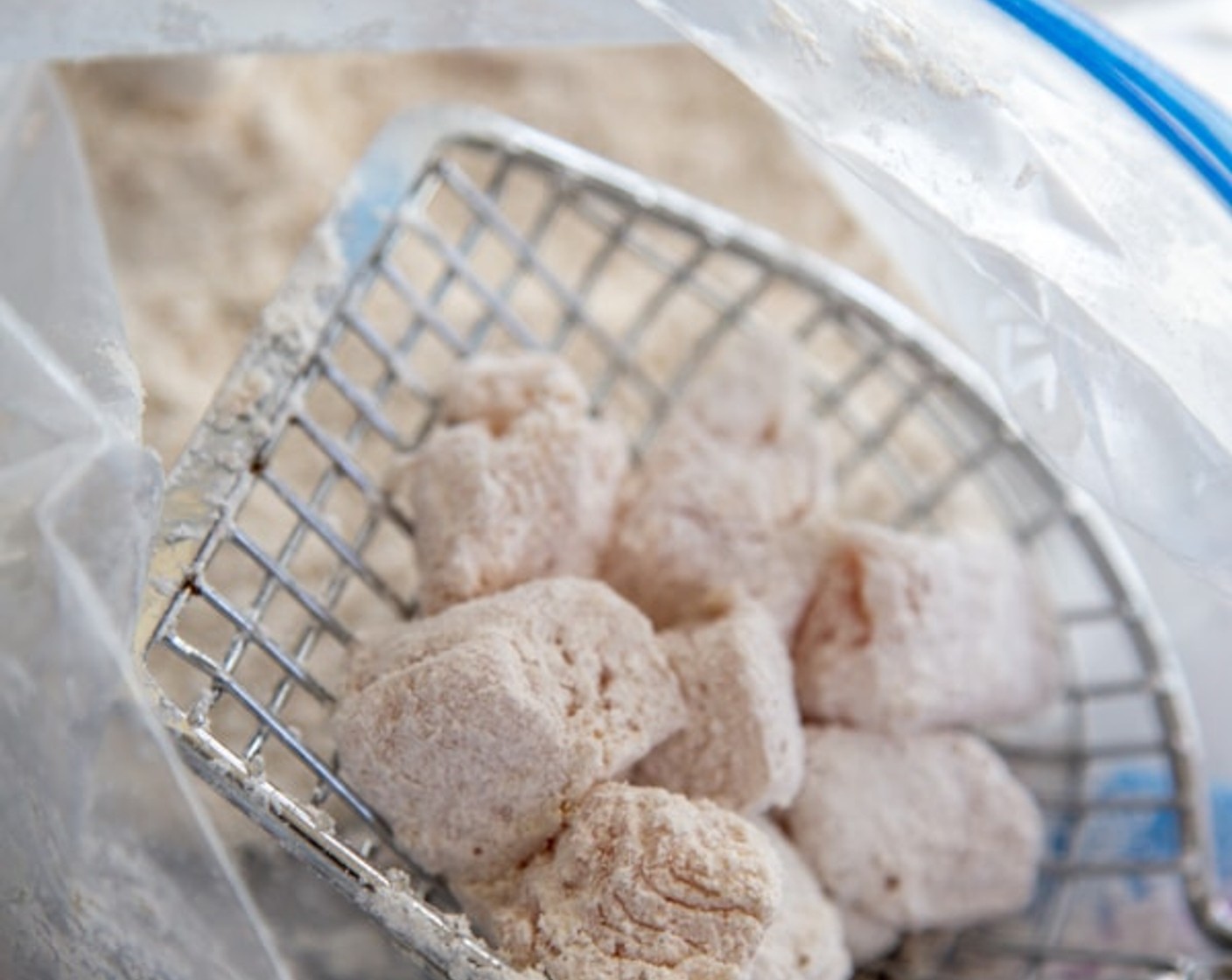 step 2 Cut the Boneless, Skinless Chicken Breasts (2 lb) into 1-inch cubes and add to the bag of corn starch, seal, and toss chicken until all the pieces are well coated. Remove chicken from the bag, making sure to remove any excess cornstarch.