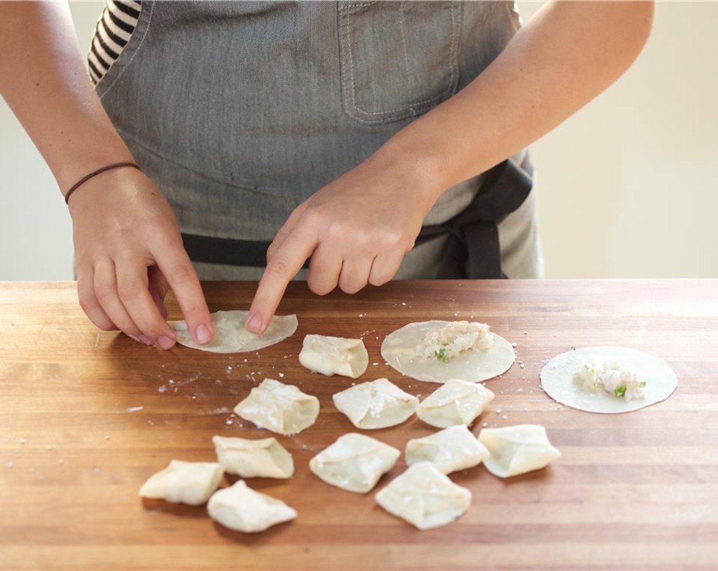 step 4 Pat dry Shrimp (12) with paper towels and roughly chop. Place in a medium bowl. Add the Sesame Oil (2 tsp), Salt (1/4 tsp), a pinch of pepper, half of the quarter inch sliced green onions, and half of the Corn Starch (1 Tbsp). Mix until well combined.