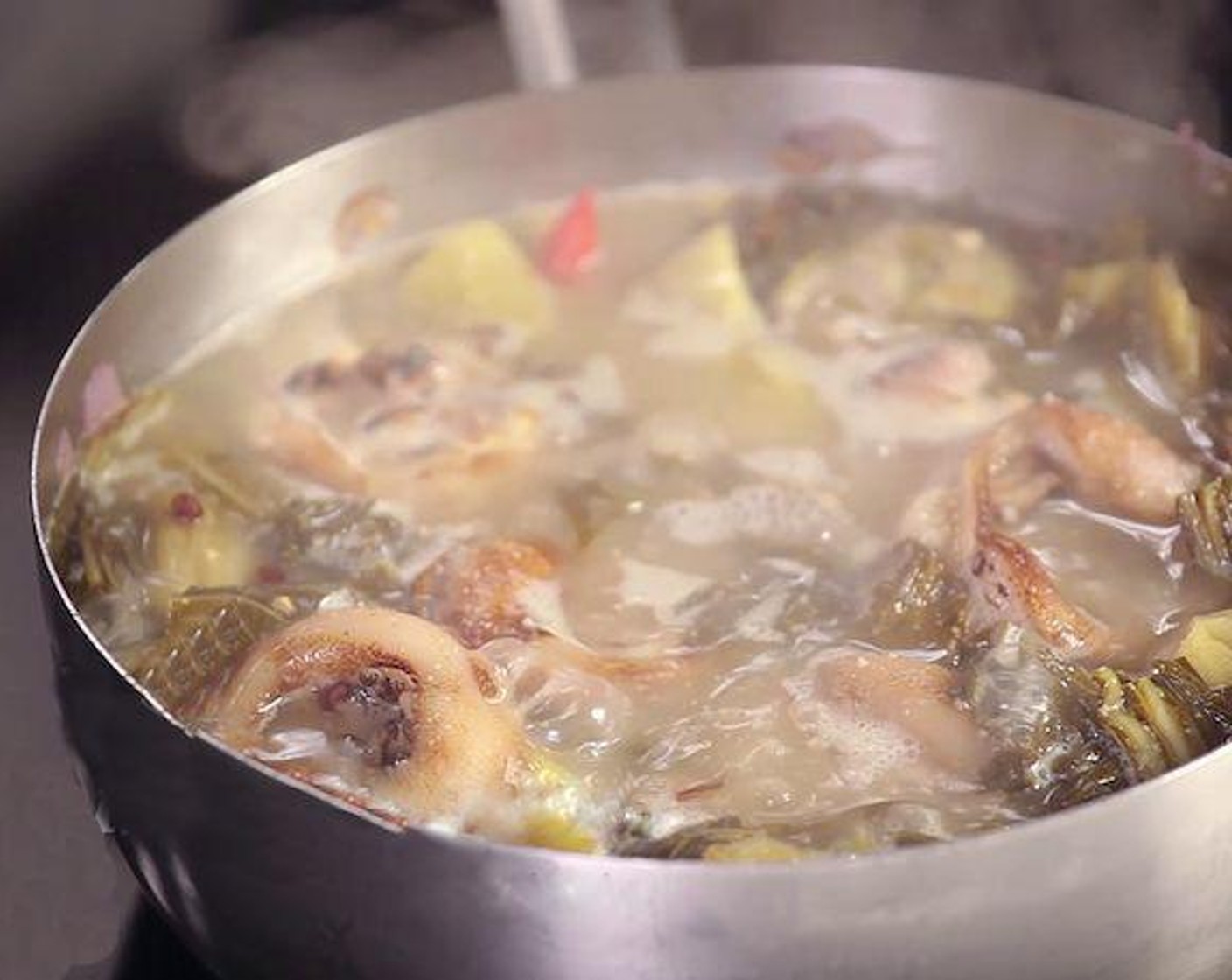 step 4 Add pickled water into the pan, add pork leg, Water (43 3/4 cups), Vegetable Stock (2 cups), Peanuts (3 Tbsp), Salt (1/2 tsp), Granulated Sugar (1 tsp), Vietnamese Spice Blend (1 tsp), and Fish Sauce (1 Tbsp). Mix well then simmer for 45 minutes.