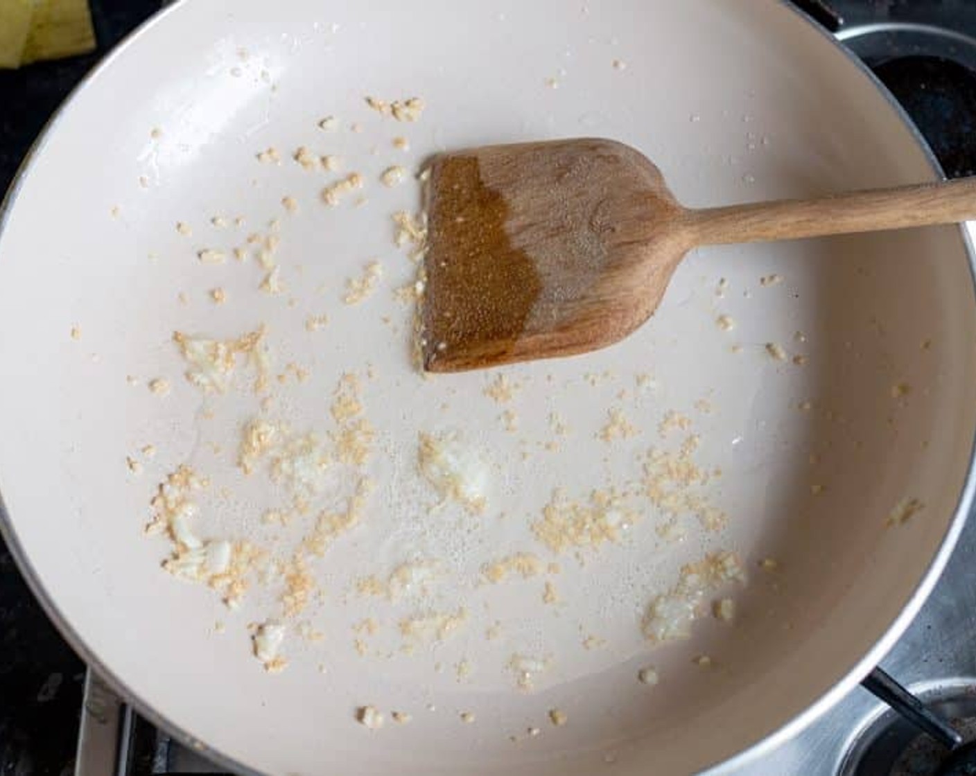 step 1 Heat the Olive Oil (1 Tbsp) in a large, non-stick frying pan, add Garlic (1 clove), and fry until golden.