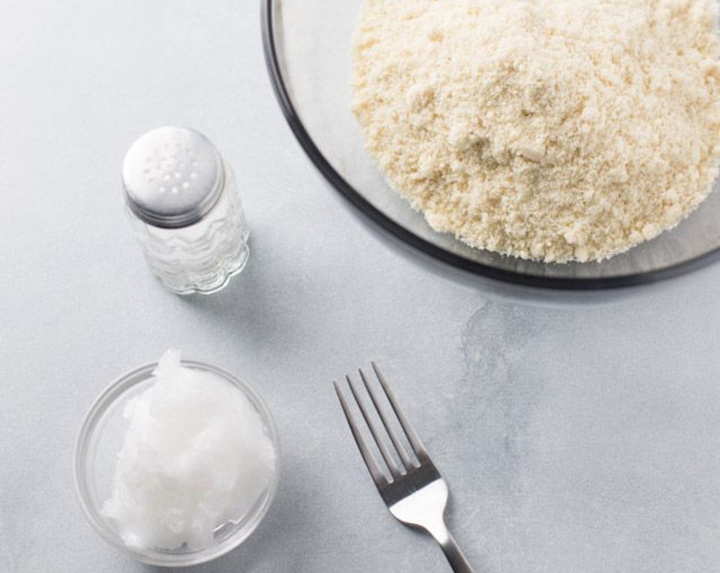 step 2 Mix Almond Flour (1 1/4 cups), Coconut Oil (1/4 cup) and Salt (1 dash) in a mixing bowl with a fork until well blended.