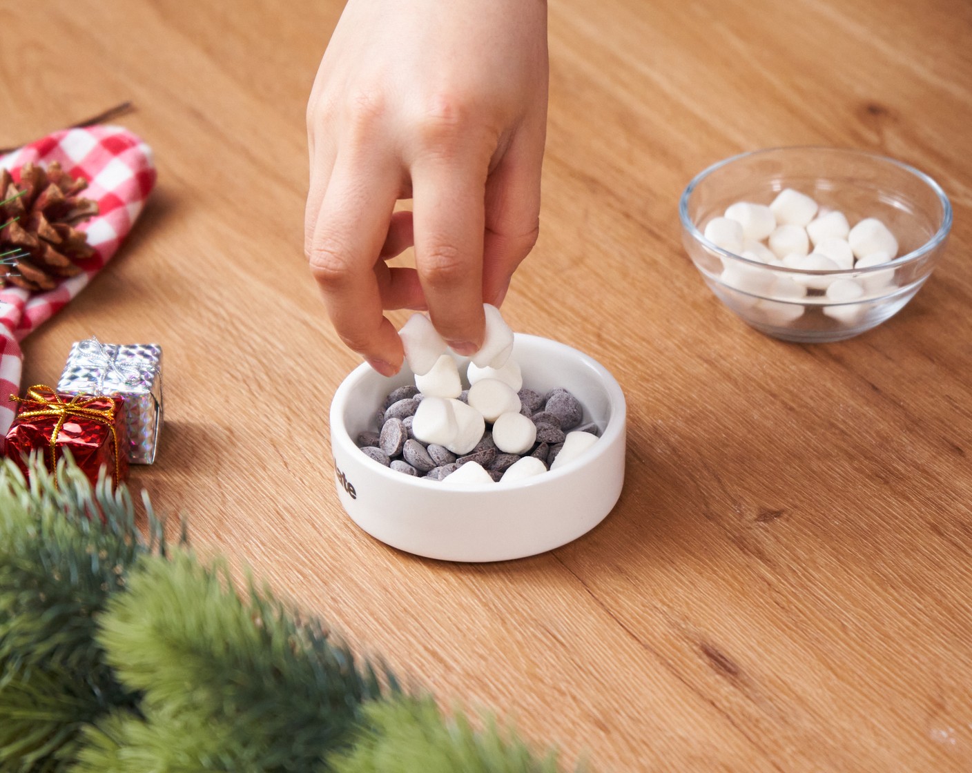 step 2 Place the Dark Chocolate (2 Tbsp) into a shallow oven-safe ramekin, and sprinkle Mini Marshmallows (1/4 cup) on top. Bake in the oven for 5-8 minutes or until the top of the marshmallows is golden brown.