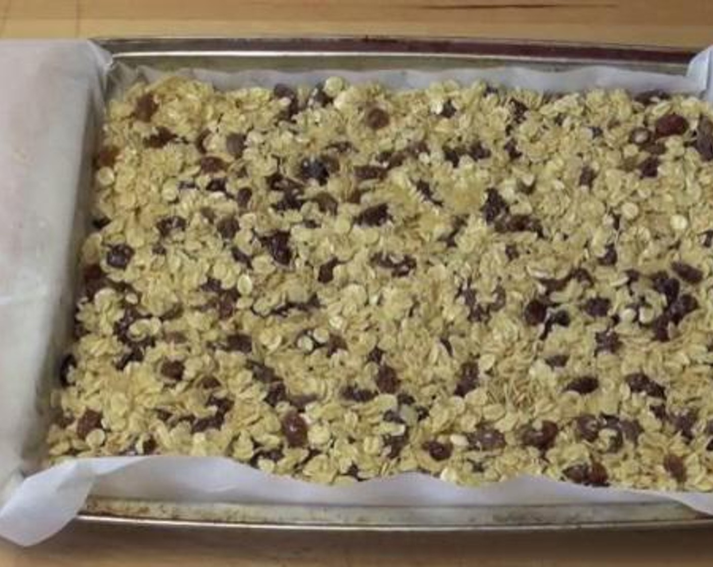 step 2 In a baking tray lined with baking paper, transfer the oats mixture. Bake inside a preheated oven, at 180 degrees C (350 degrees F) for about 15 minutes.
