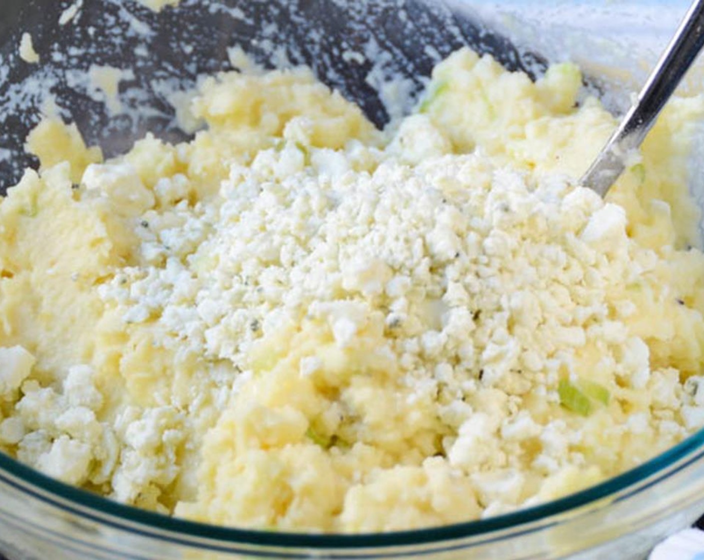 step 3 Transfer the mashed potatoes to the casserole dish and smooth the top with the back of a spoon.