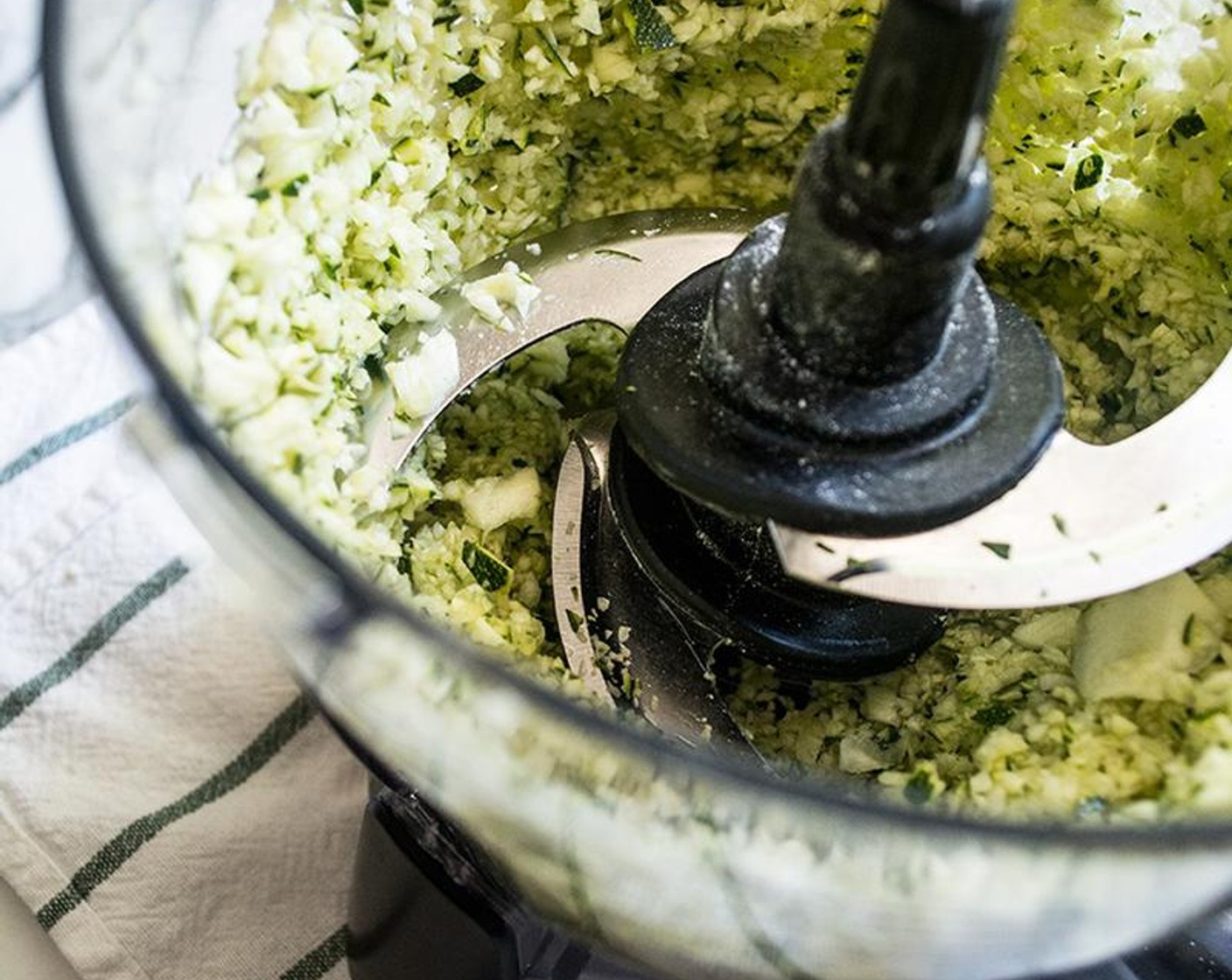 step 4 Stir in finely grated Zucchini (1 1/2 cups) and mix until zucchini is completely coated in the oat flour/cocoa mixture.