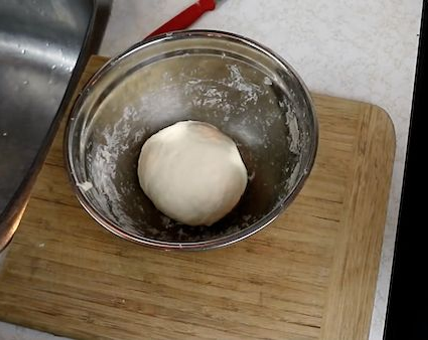 step 10 Once you've kneaded the dough into a nice ball, let It rest in the bowl while covered with a damp paper towel for about 10 minutes.