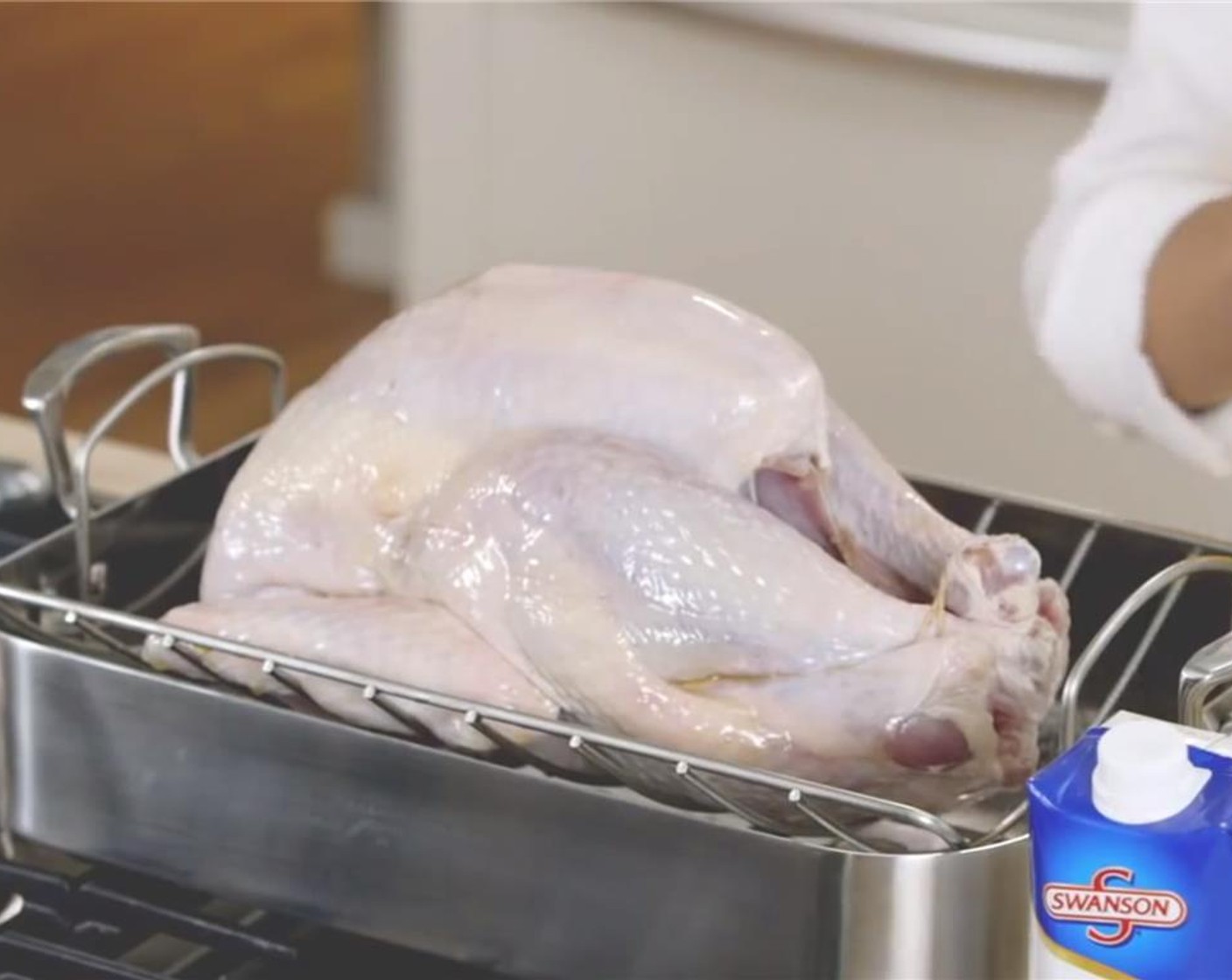 step 1 Preheat oven to 325 degrees F (160 degrees C). Remove the package of giblets and neck from the cavity of the Whole Turkey (12 lb). Rinse the turkey with cold water and pat dry with a paper towel. Tie the ends of the drumsticks together.