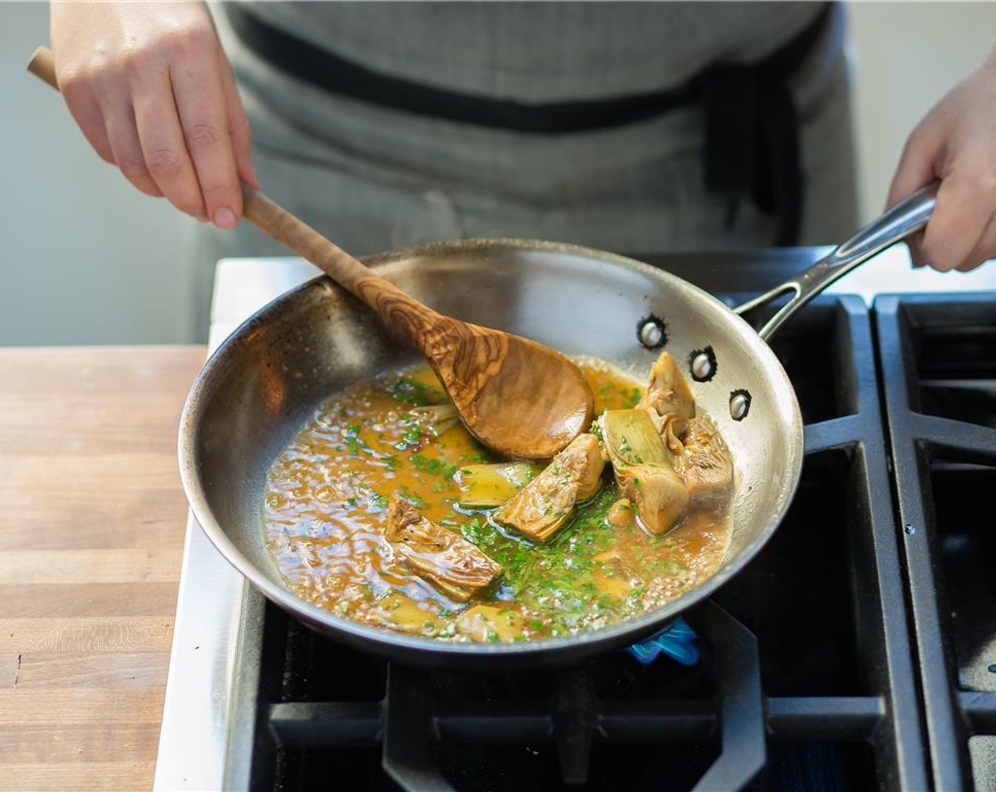 step 13 When oil is hot, add Artichoke Hearts (2/3 cup) and cook for three minutes until golden brown.