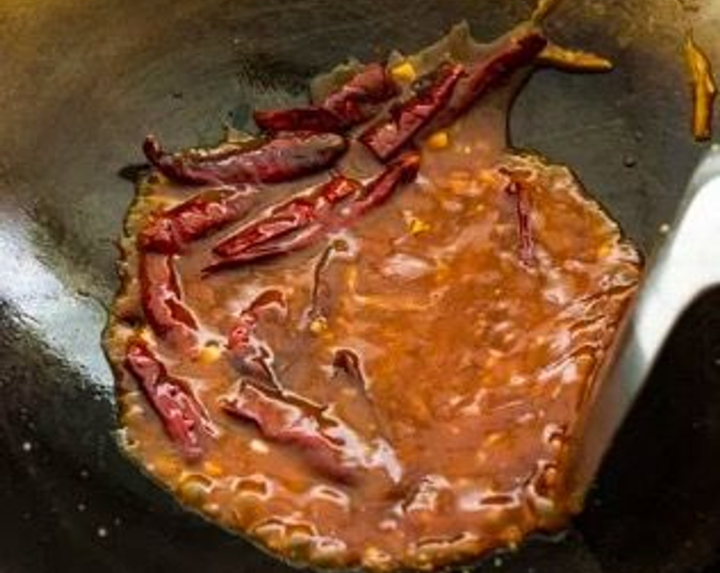 step 9 Give the sauce a good stir, then pour it into the wok. Stir until slightly thickened.