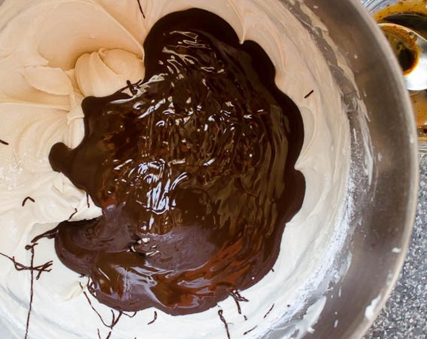 step 10 In a large bowl, beat the Butter (1 cup) until light and airy. Beat in the Vanilla Extract (1 tsp) and Powdered Confectioners Sugar (2 cups) until smooth. Add melted chocolate and instant espresso in water and beat until well combined.