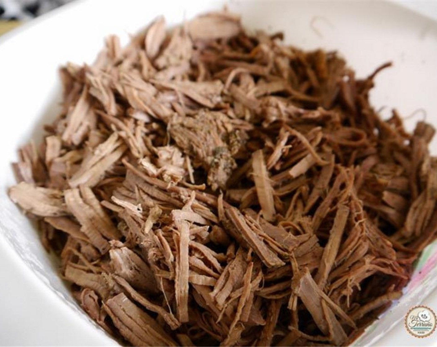 step 1 Add Beef Brisket (2.2 lb), Dried Basil (3 Tbsp), Ground Cumin (1 Tbsp), Dried Rosemary (3 Tbsp), Worcestershire Sauce (3 Tbsp), Dried Oregano (2 Tbsp), salt and pepper, the Onions (2), and Garlic (8 cloves) in a baking tray.