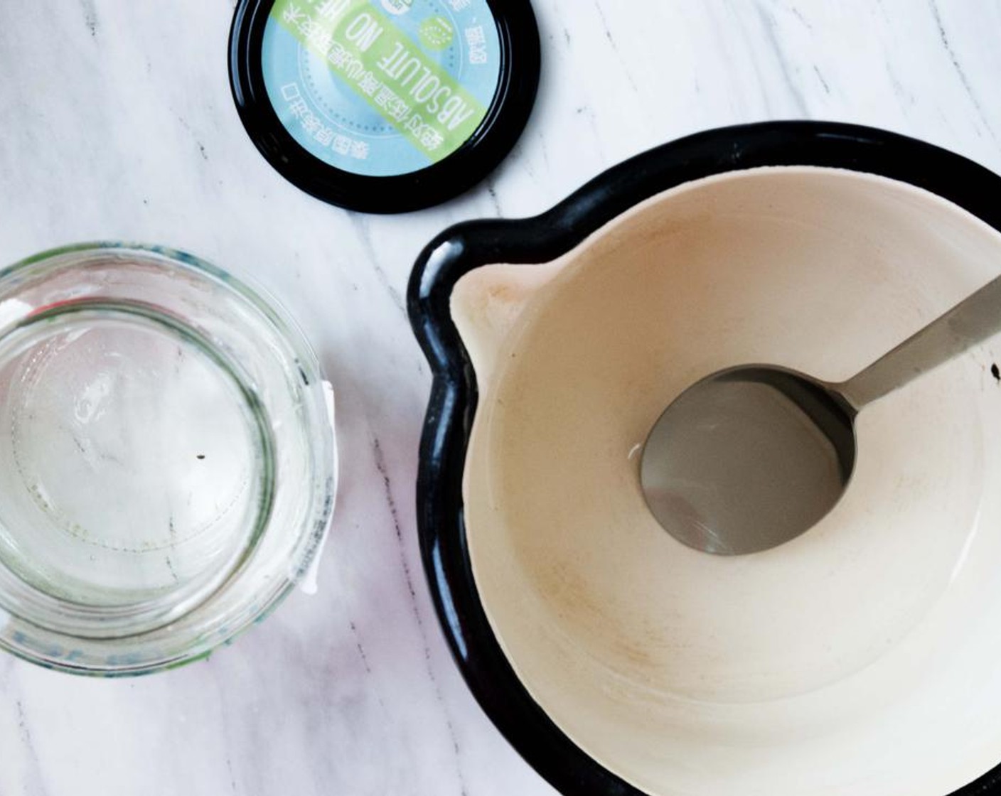 step 1 In a saucepan, melt the Coconut Oil (1/4 cup) over low heat.