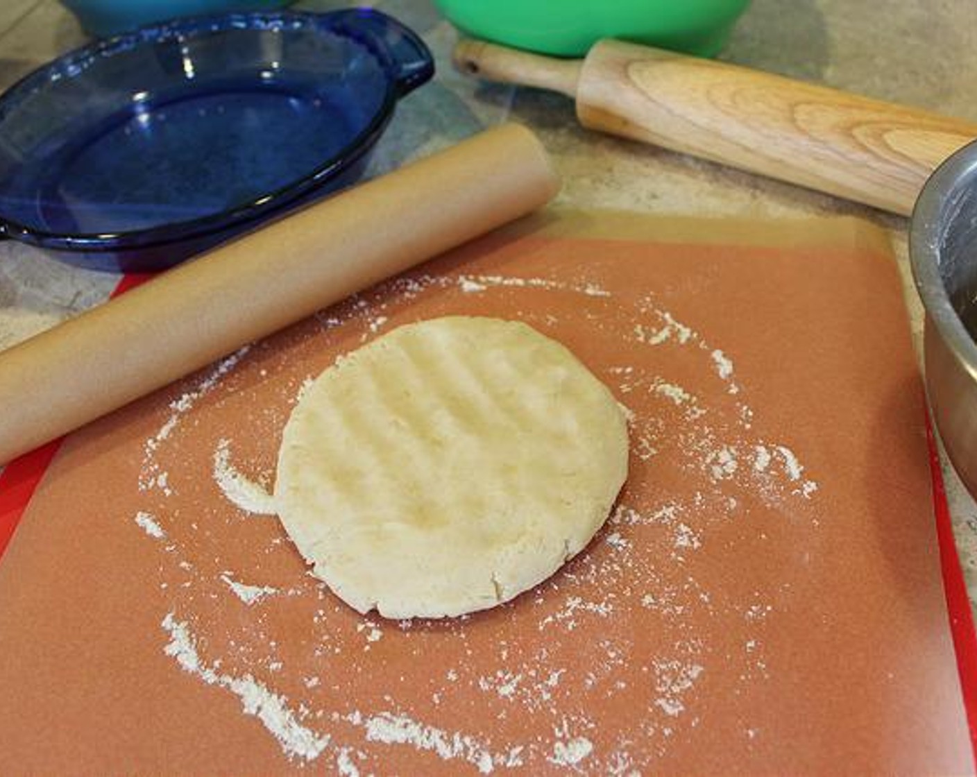 step 3 Cut Mixture in Half and roll into 2 balls - one for each crust or topping. Shape dough balls into disc with floured hands and place onto a sheet of floured parchment or wax paper.