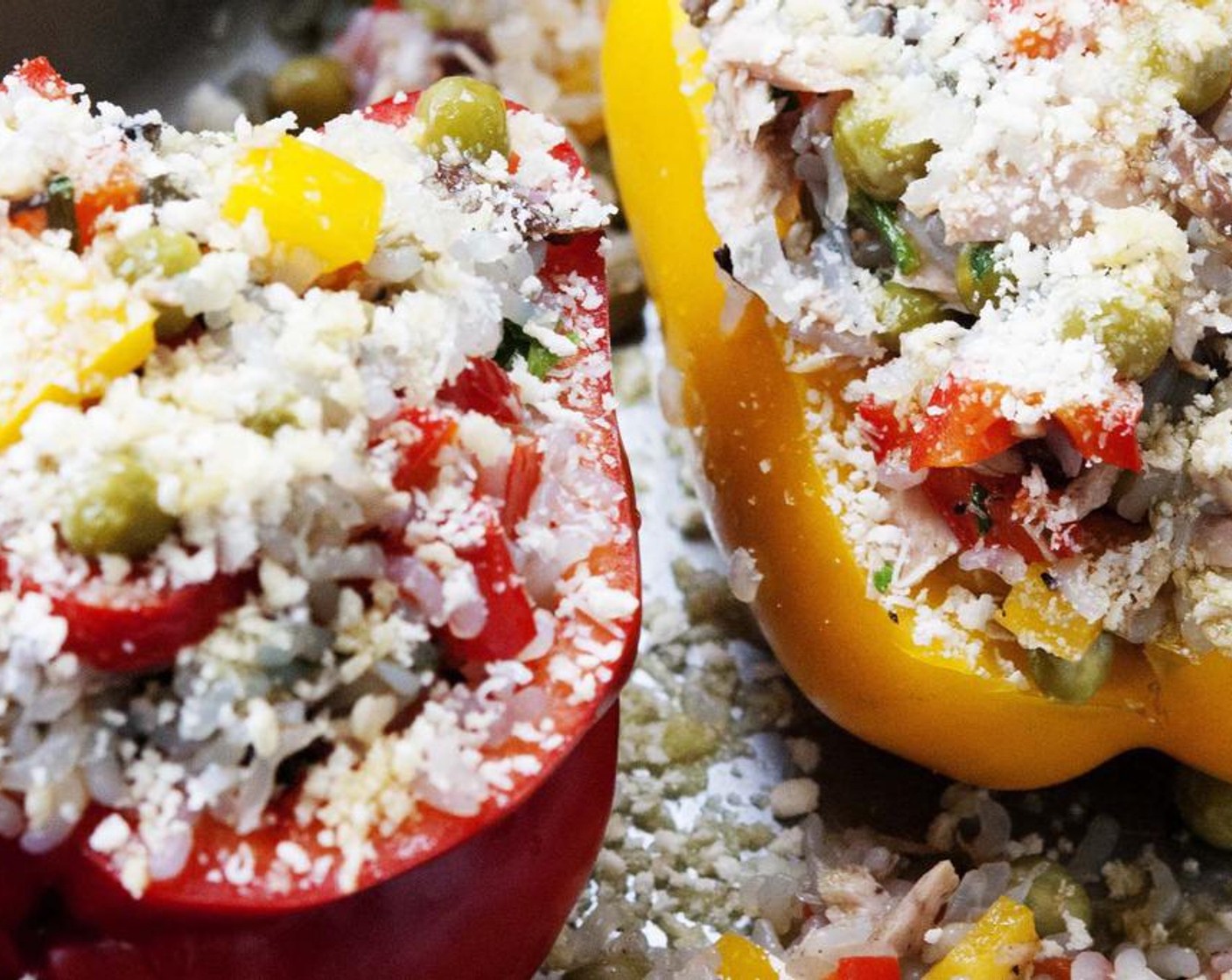 step 7 Scoop the filling into the bell pepper cups. Fill them up almost to the edge.Then add the Mozzarella Cheese (2 Tbsp). Then cover with the remaining filling. Top it off with Parmesan Cheese (2 Tbsp), Breadcrumbs (2 Tbsp), and a drizzle of extra virgin olive oil.