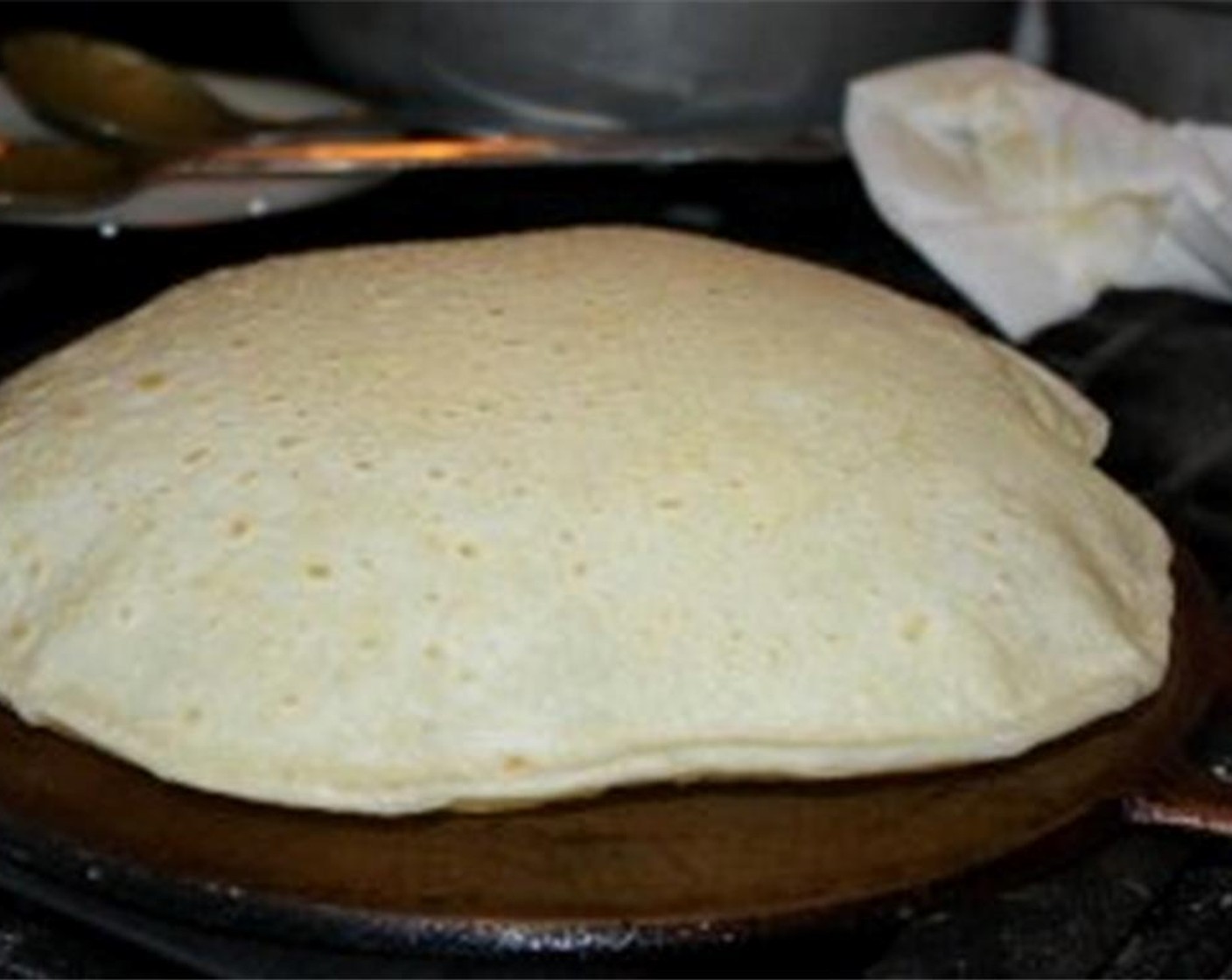 step 11 It will take about 4-6 minutes to fully cook and you’ll notice that it will start to “swell” or inflate as it cooks. That’s a sign that it’s ready to be removed off the tawa. Repeat this step for the remaining 6 roti.