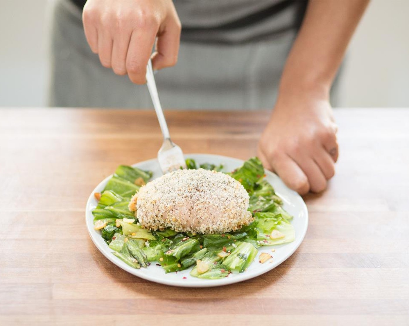 step 12 In the center of two plates, place the escarole. Top with Chicken Cordon Bleu. Serve and enjoy!